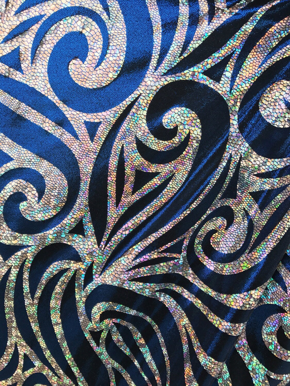 Metallic spandex with swirl hologram foil design 58/60" sold by the yd. Ships worldwide from Los Angeles CA United States.