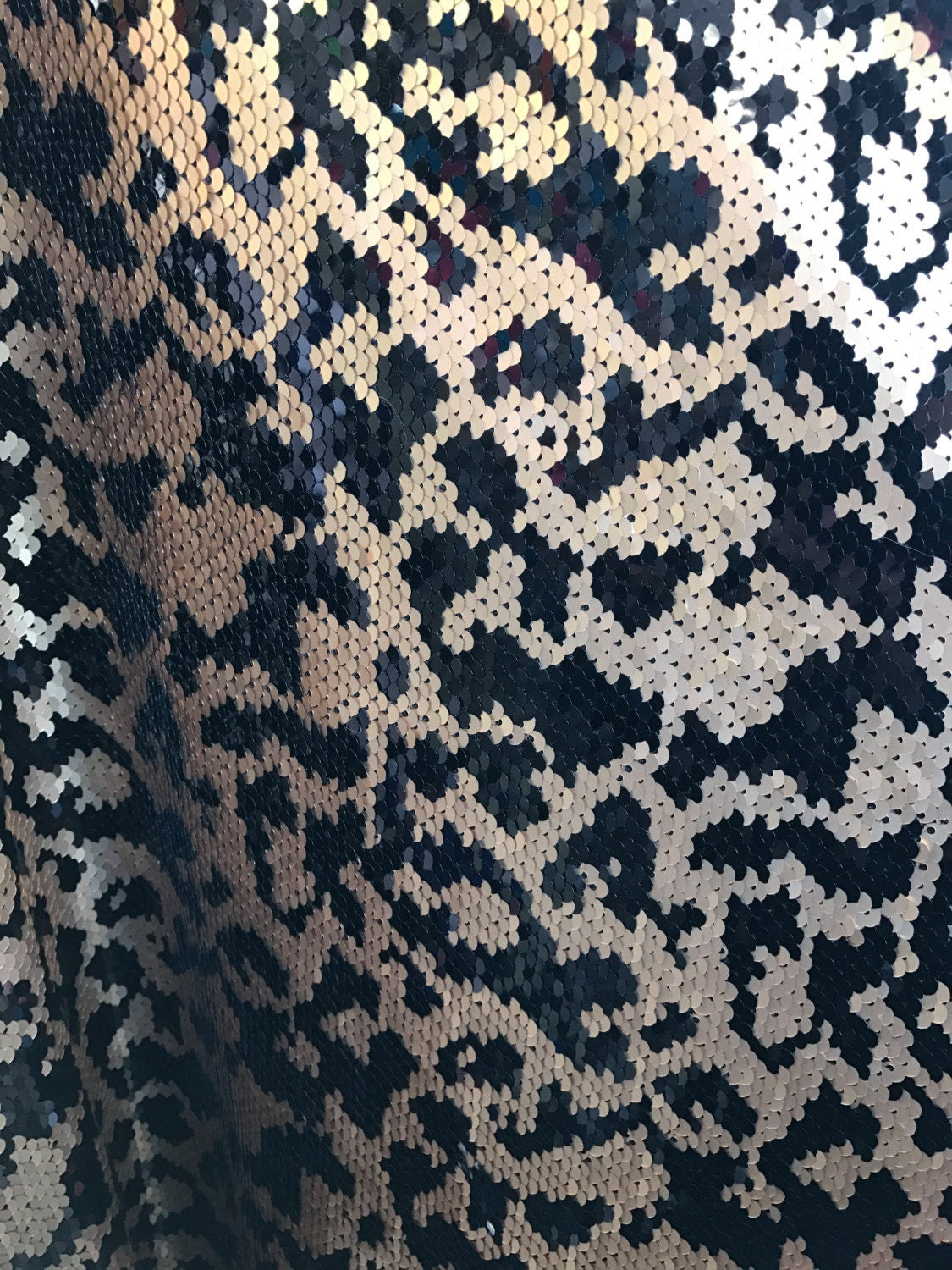 Animal print 5mm sequins 58/60" on Lycra base 2way stretch. Sold by the yd. Ships worldwide from Los Angeles California USA