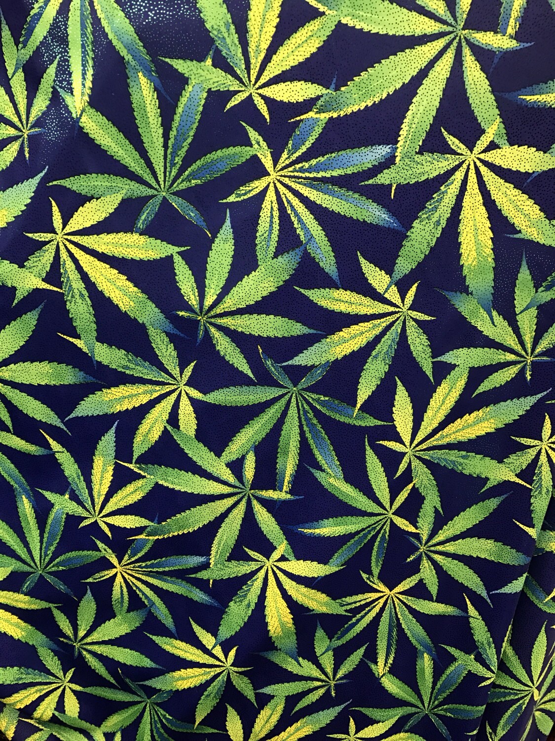 Marijuana design nylon spandex with foggy foil all over 4 way stretch 58/60" sold by the yd. ships worldwide from Los Angeles California USA