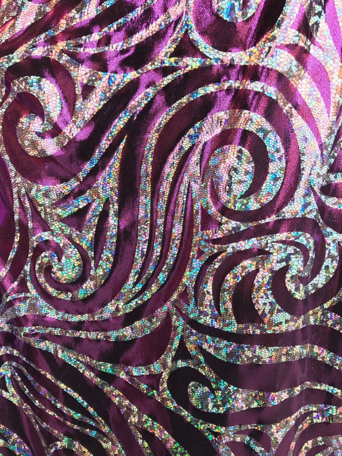 Metallic spandex with swirl hologram foil design 58/60" sold by the yd. Ships worldwide from Los Angeles CA United States.