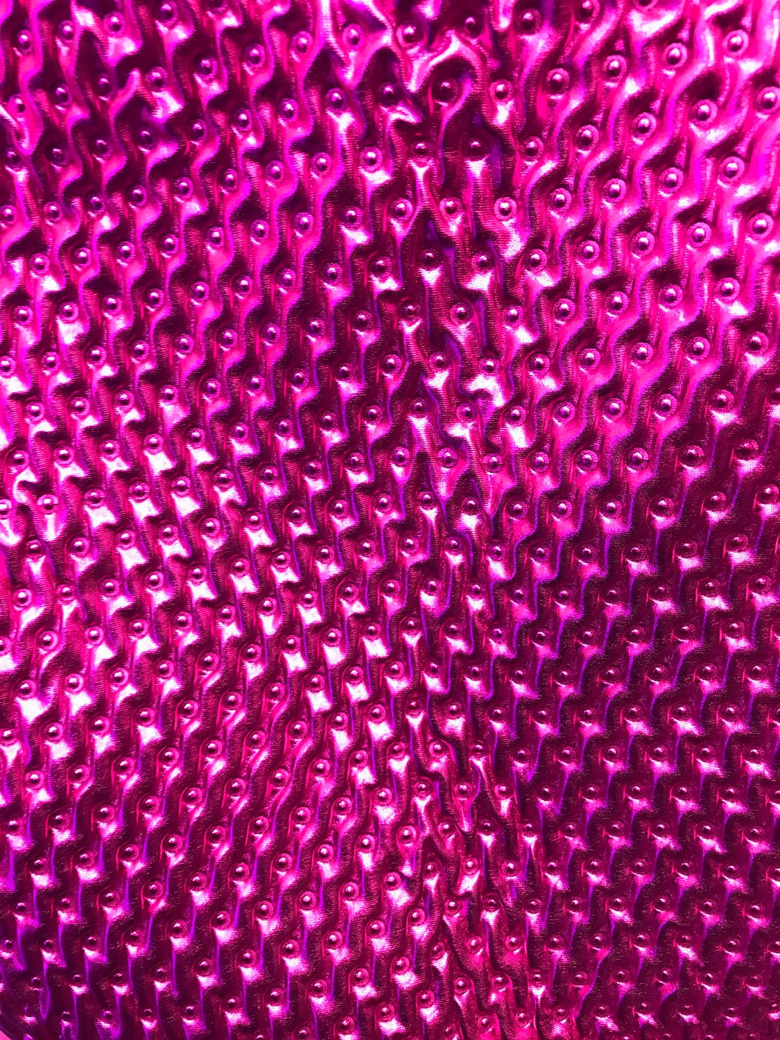 Quilted foil 2way stretch, fuschia all over foil 58/60" Sold by the YD. Ships worldwide from Los Angeles California USA.