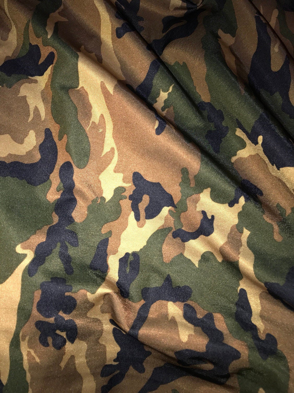 Camouflage design on nylon spandex print 4way Stretch 58/60" Sold by the yd. Ships worldwide from Los Angeles California USA.