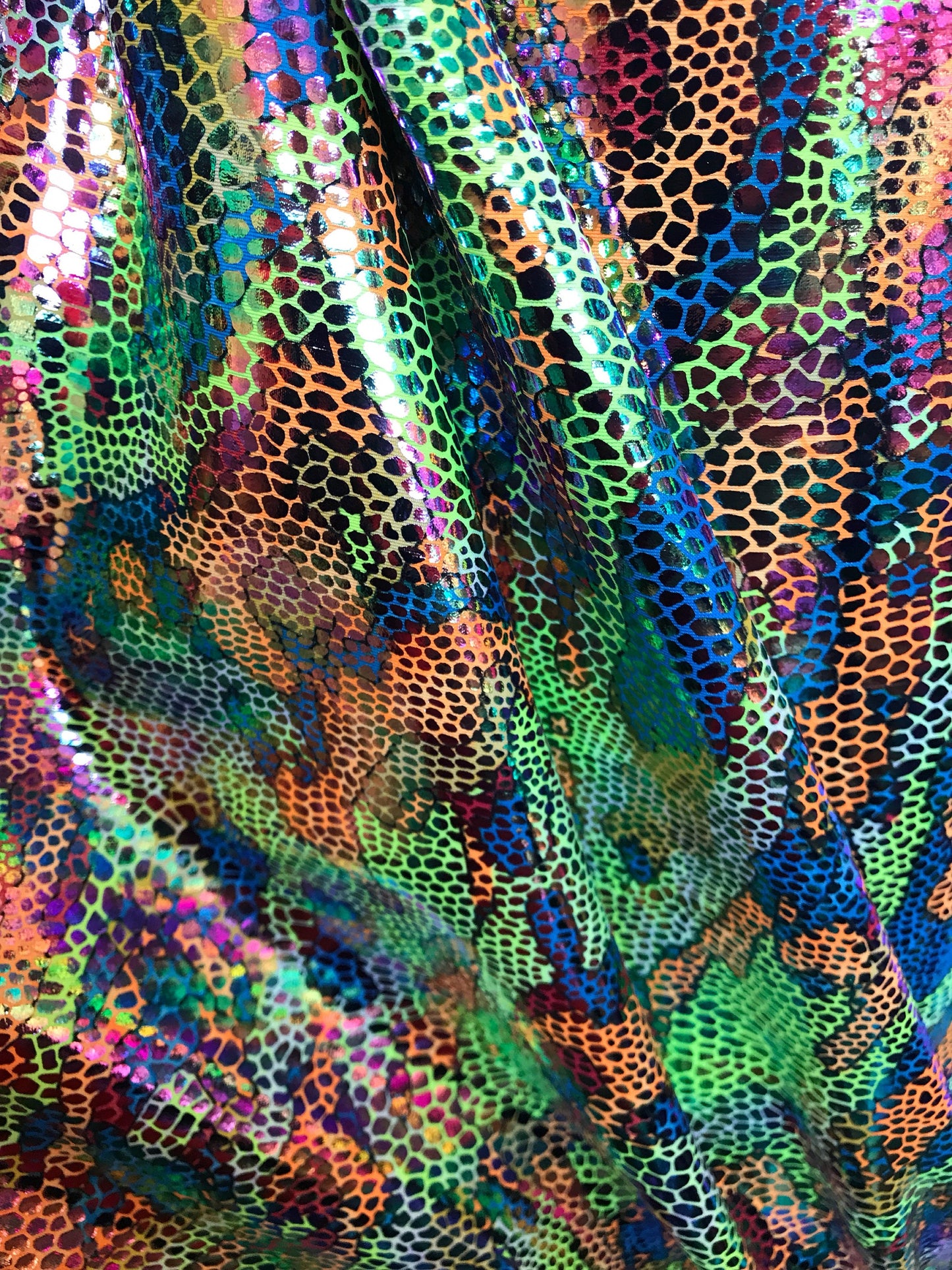 New reptile design with foil all over nylon spandex 4way Stretch 58/60" Sold by the Yd. Ships worldwide from Los Angeles California USA