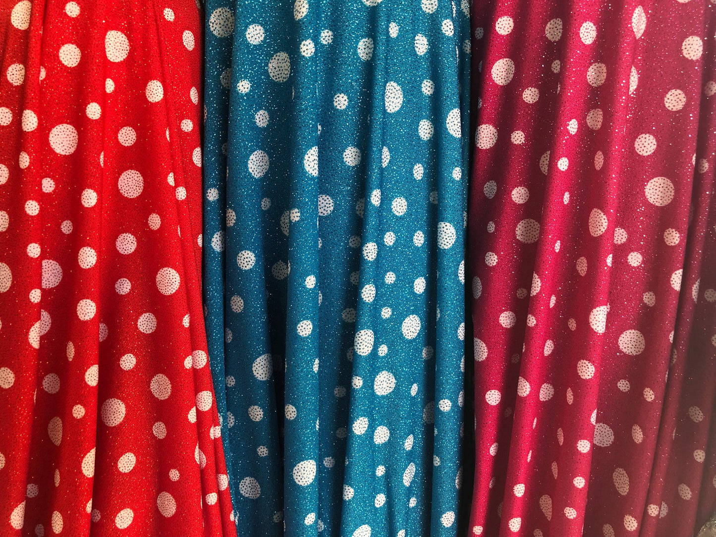 New spandex polka dots Design with glitter 4 way stretch 58/60" Sold by the YD. Ships worldwide from Los Angeles California USA.
