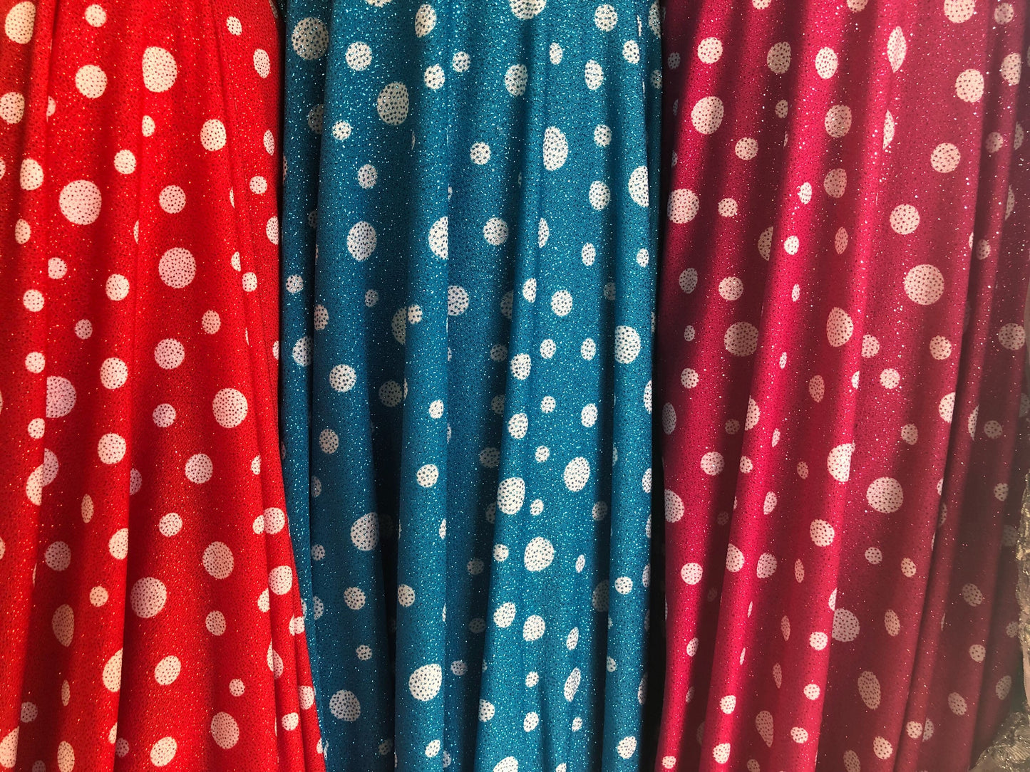 New spandex polka dots Design with glitter 4 way stretch 58/60" Sold by the YD. Ships worldwide from Los Angeles California USA.