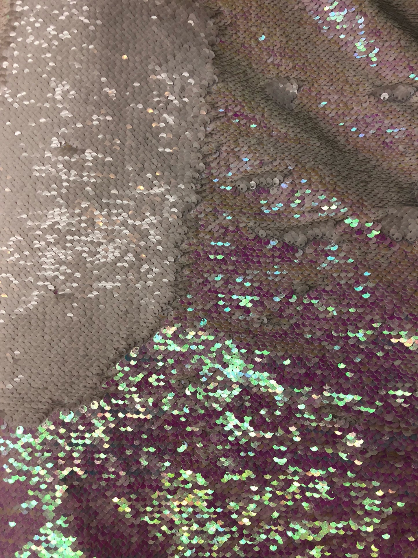 Mermaid sequins iridescent white 2tone with spandex base 2 way Stretch 58/60" Sold by the YD. Ships worldwide from Los Angeles California.