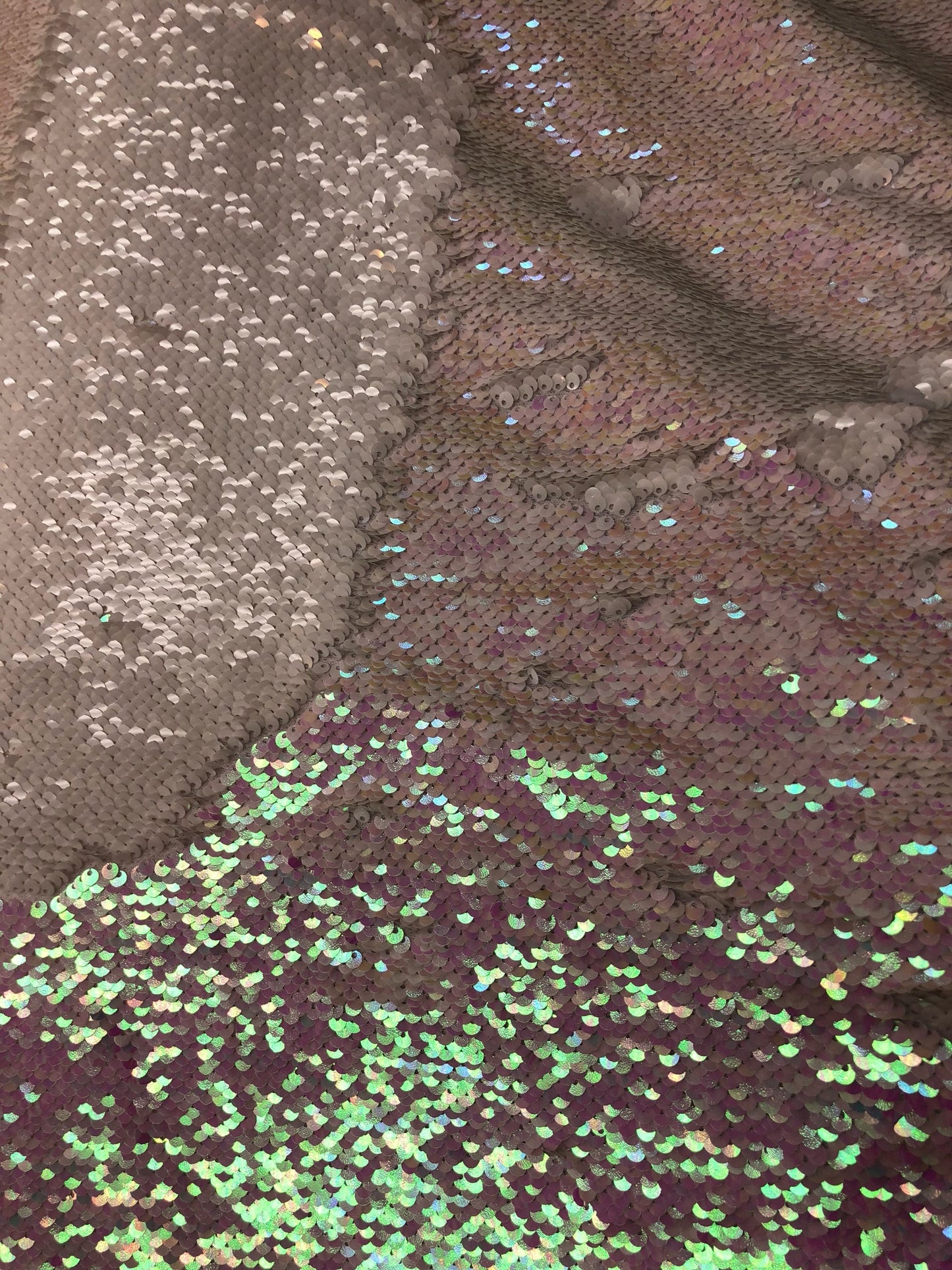 Mermaid sequins iridescent white 2tone with spandex base 2 way Stretch 58/60" Sold by the YD. Ships worldwide from Los Angeles California.
