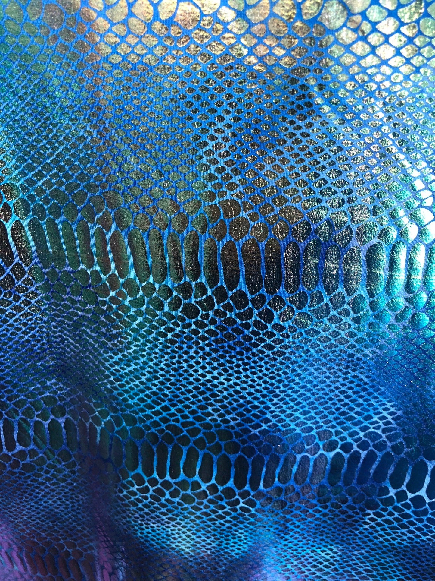 New iridescent metallic nylon spandex dragon design 4way stretch 58/60" Sold by the YD. Ships worldwide from Los Angeles California USA.