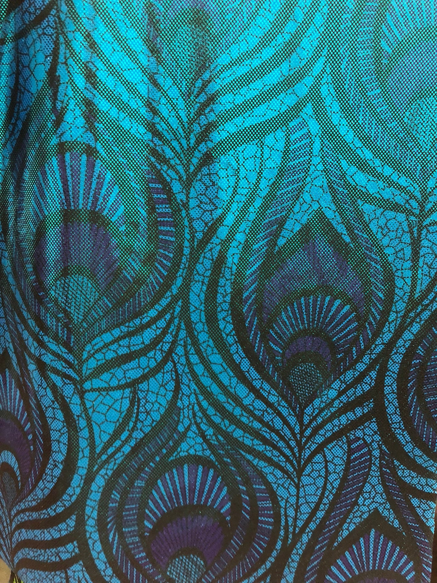 New nylon spandex peacock magic eye design with all over foil 4way stretch 58/60" Sold by the YD. Ships worldwide from Los Angeles CA USA.