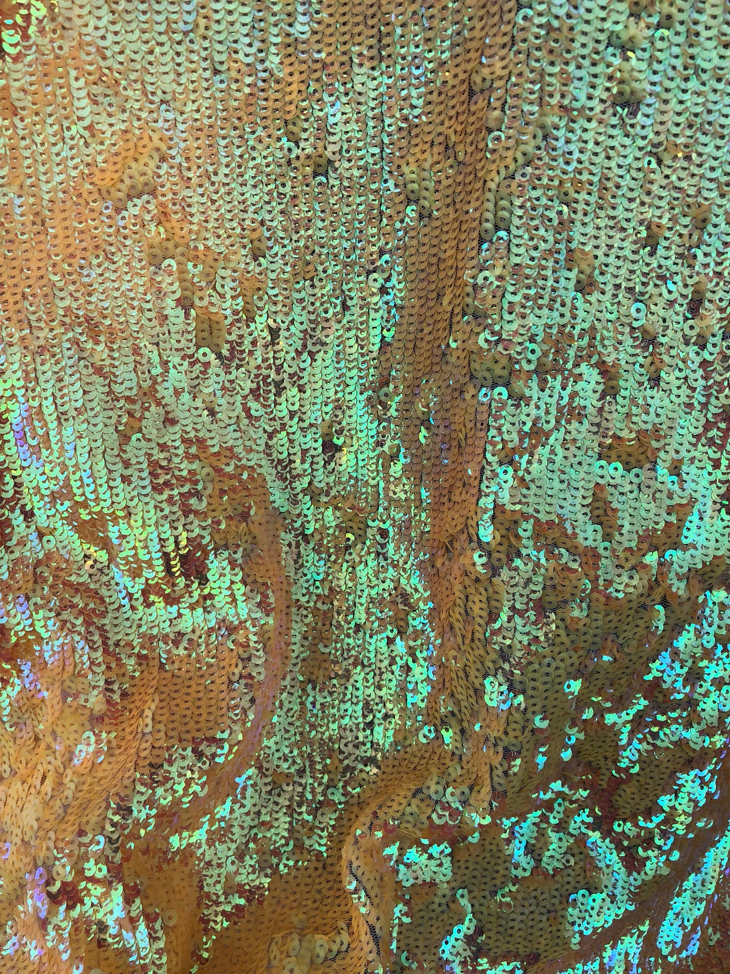 New sequins iridescent orange coral on stretch mesh 2way 58/60" Sold by the YD. Ships worldwide from Los Angeles California USA.