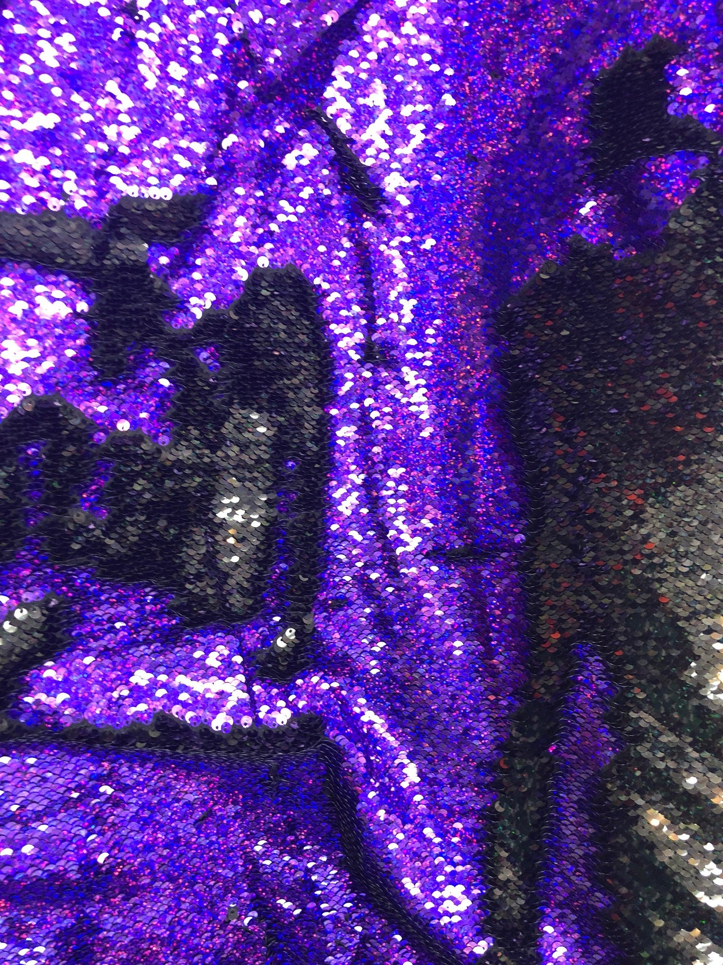 New flip up hologram sequins black/purple reversible sequins in spandex base 2way 58/60" Sold by the YD. Ships worldwide from L.A CA