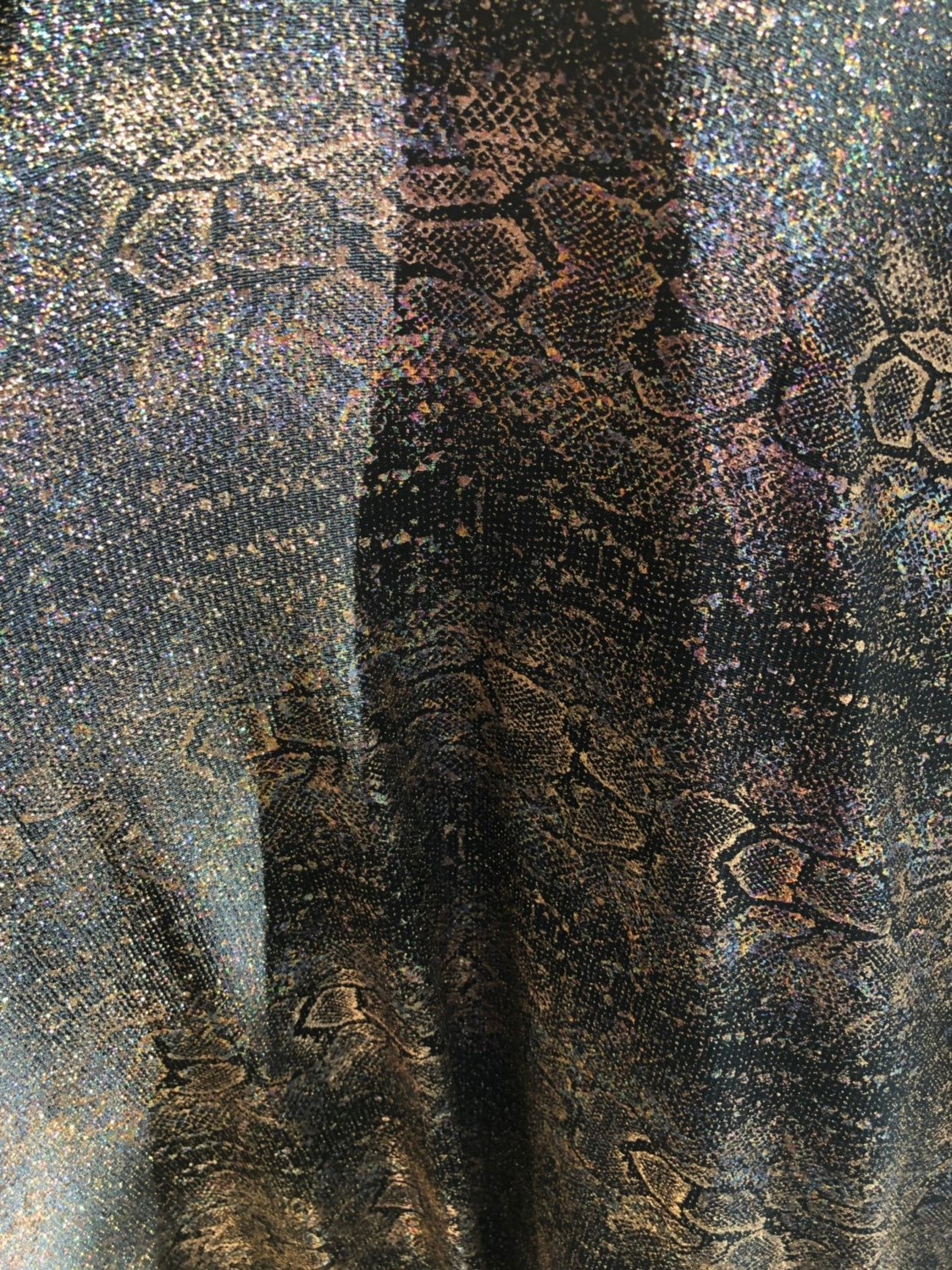 New iridescent snake design foil on slinky spandex 4way stretch 58/60" Sold by the YD. Ships worldwide from Los Angeles California USA.