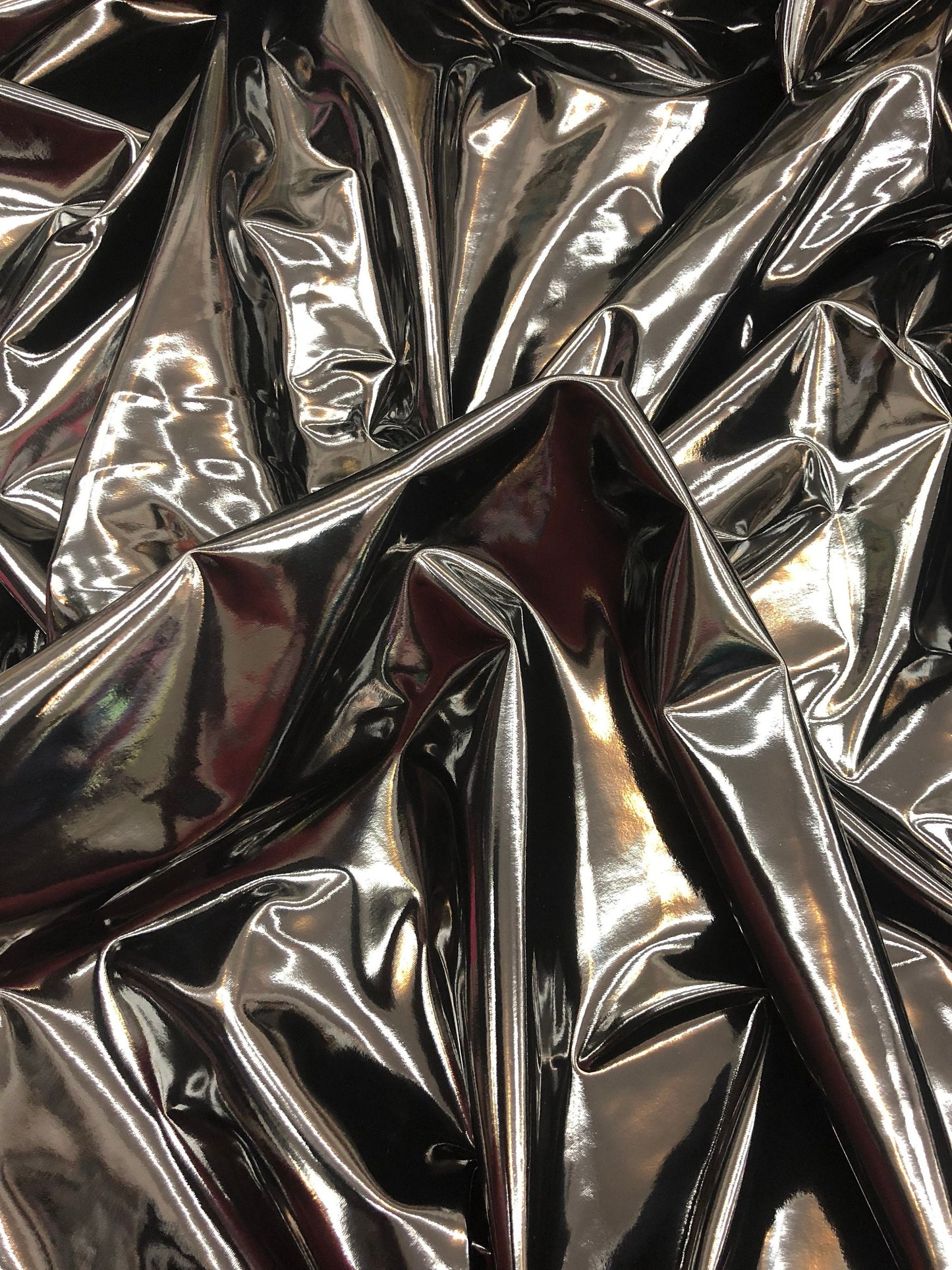 Shining black latex vinyl 4way stretch 58/60" Sold by the YD. Ships worldwide from Los Angeles California USA.