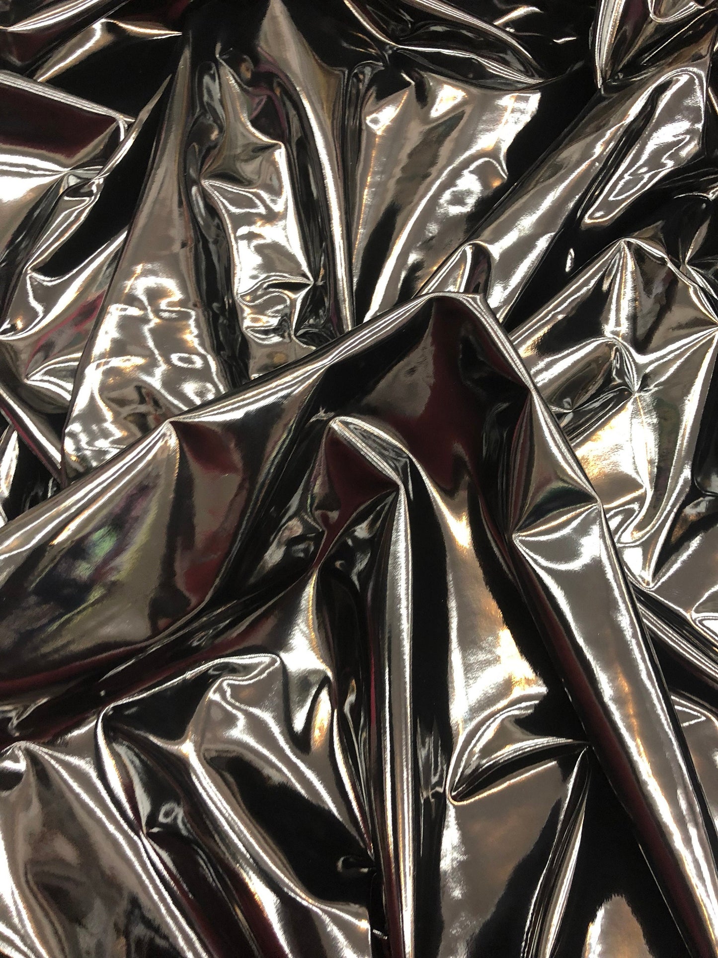 Shining black latex vinyl 4way stretch 58/60" Sold by the YD. Ships worldwide from Los Angeles California USA.