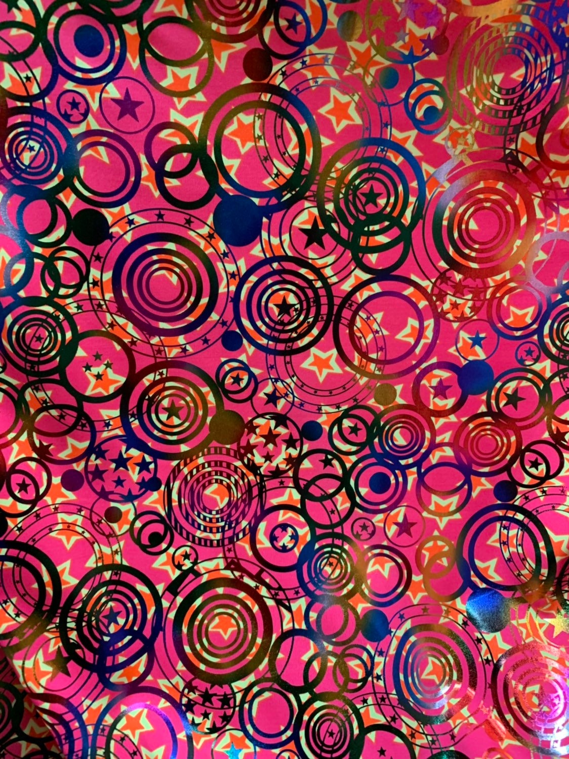 Stars and circles hologram design metallic nylon spandex 4way 58/60" Sold nubthe YD. Ships worldwide from Los Angeles California USA.