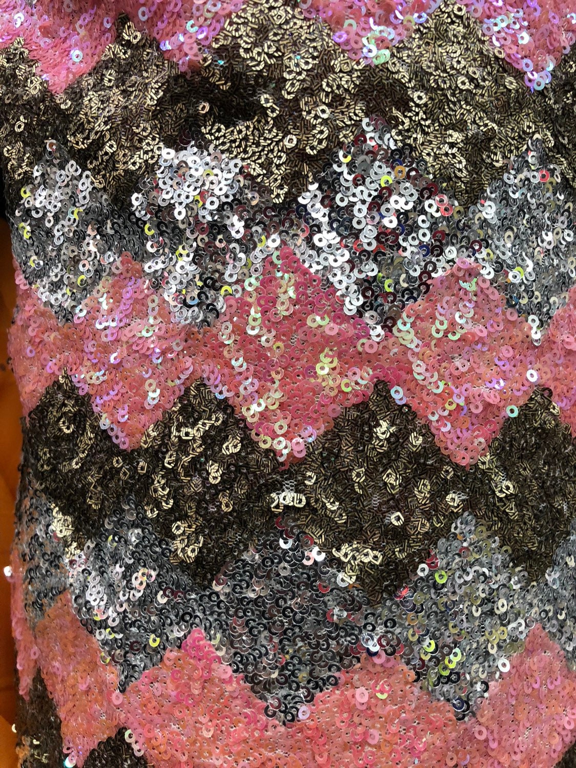 Chevron design mini glitz sequins on stretch mesh 2way stretch 58/60" Sold by the YD. Ships worldwide from Los Angeles California USA.