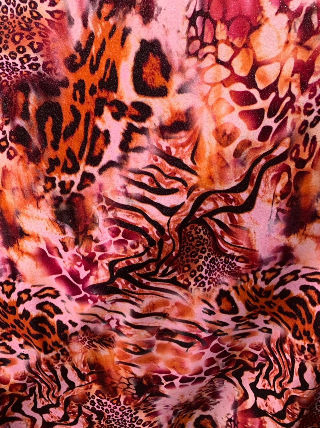 Multi animal print design on heavy stretch velvet 4way 58/60" Sold by the YD. Ships worldwide from Los Angeles California USA.