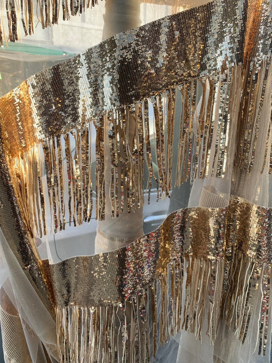 Chainette fringe sequins on mesh base 2 way stretch 55/57" Sold by the YD. Ships worldwide from Los Angeles California USA.