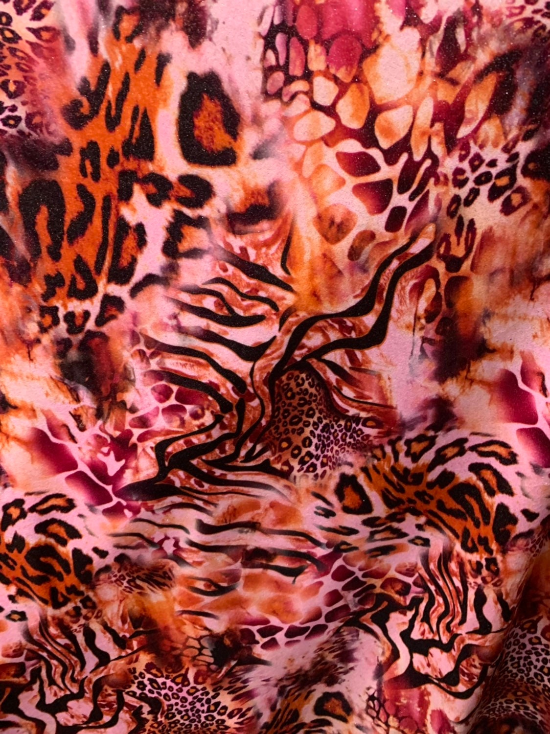 Multi animal print design on heavy stretch velvet 4way 58/60" Sold by the YD. Ships worldwide from Los Angeles California USA.