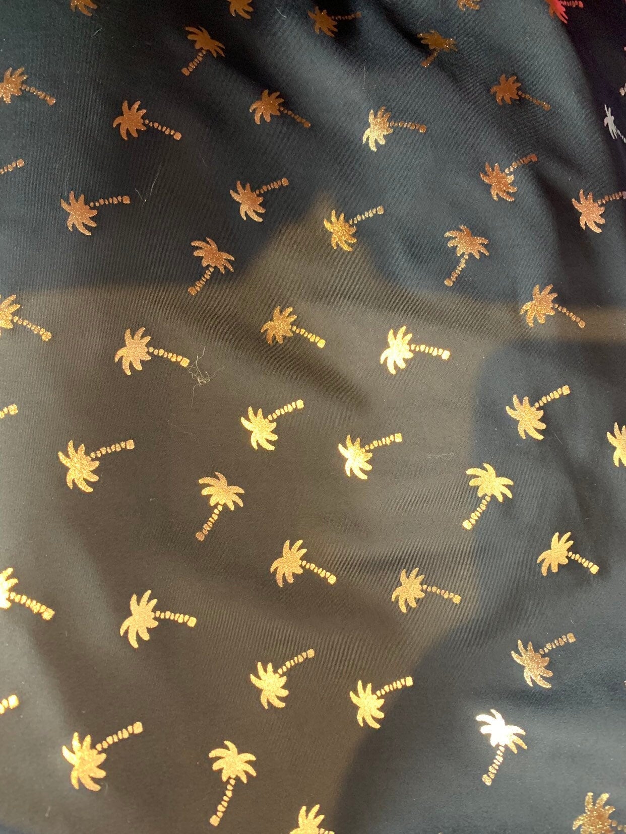 New metallic print nylon spandex palm tree design 4way stretch 58/60" Sold by the YD. Ships worldwide from Los Angeles California USA.