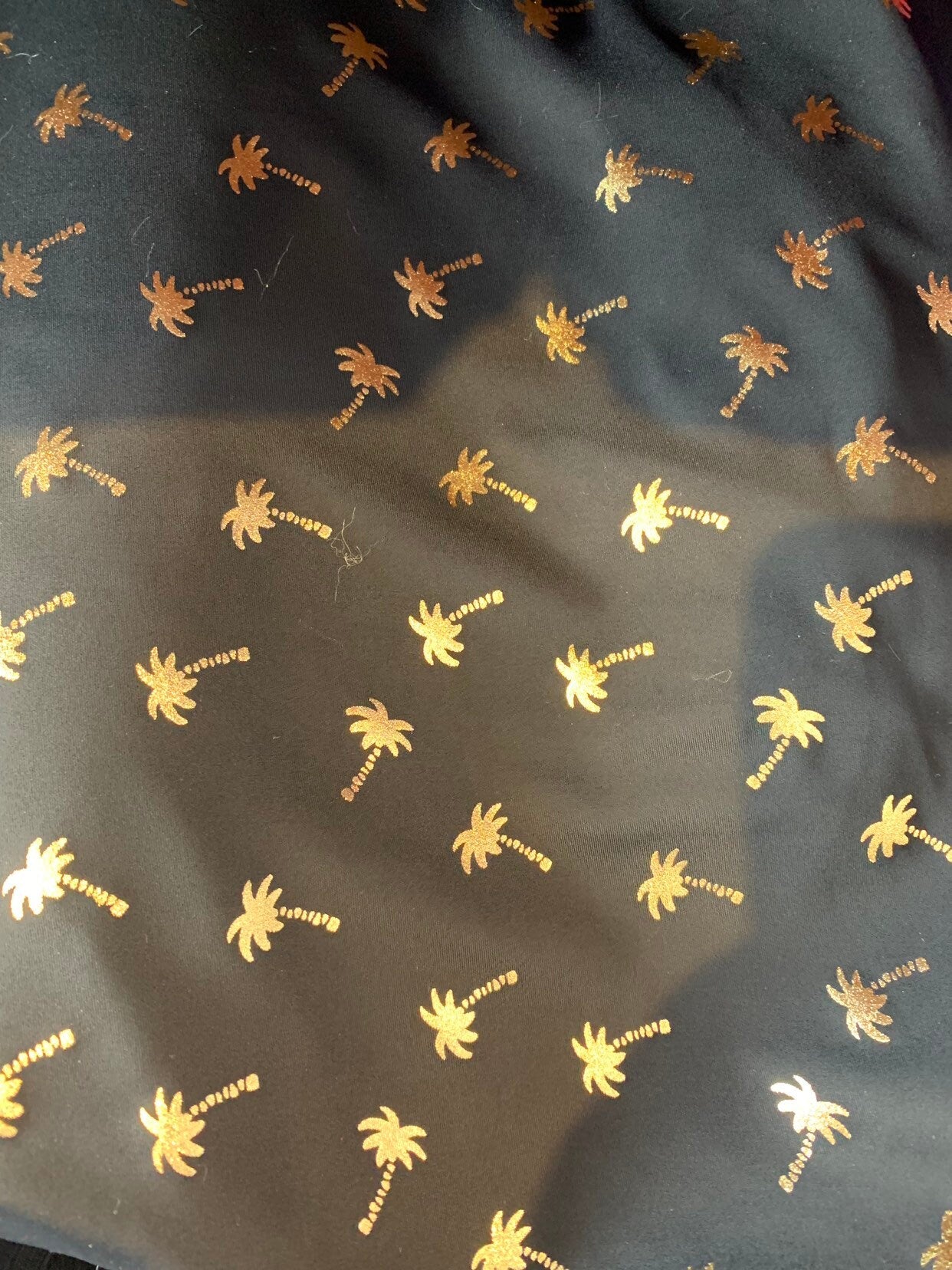 New metallic print nylon spandex palm tree design 4way stretch 58/60" Sold by the YD. Ships worldwide from Los Angeles California USA.