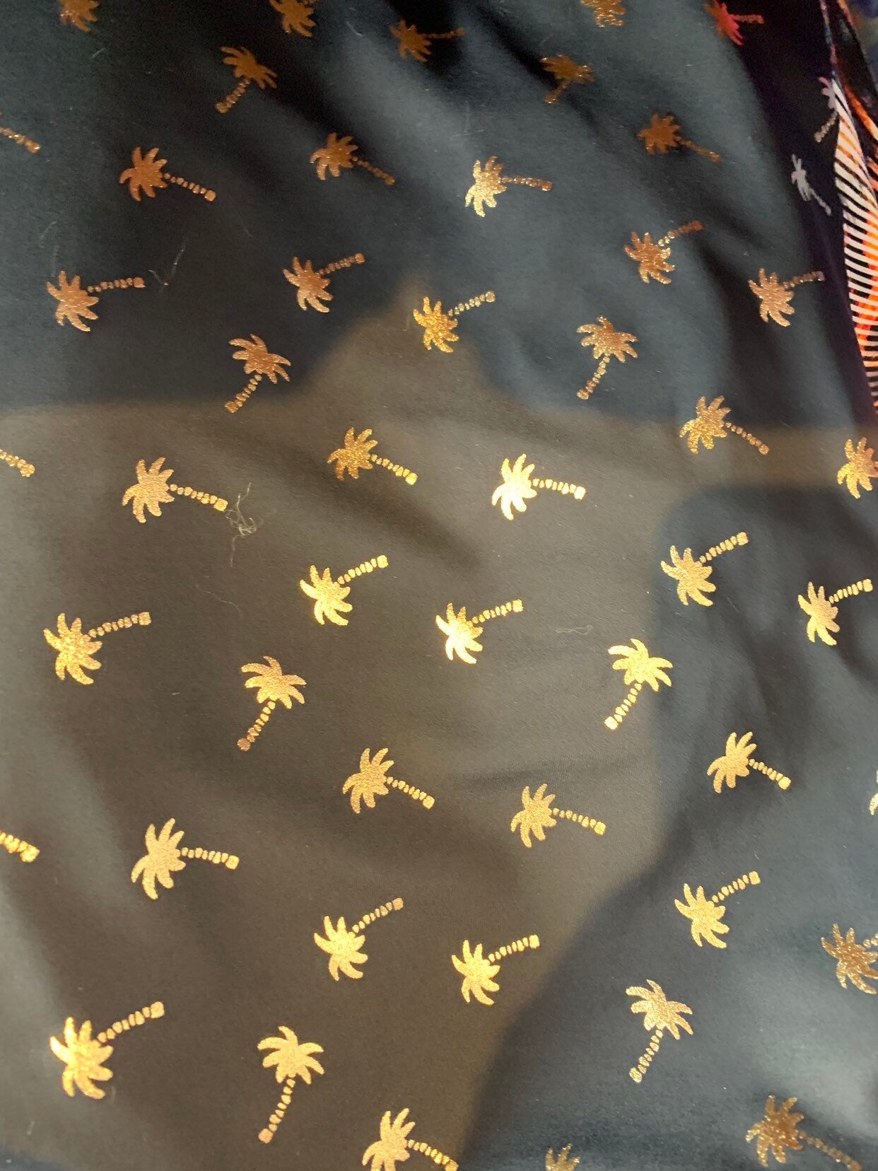 New metallic print nylon spandex palm tree design 4way stretch 58/60" Sold by the YD. Ships worldwide from Los Angeles California USA.