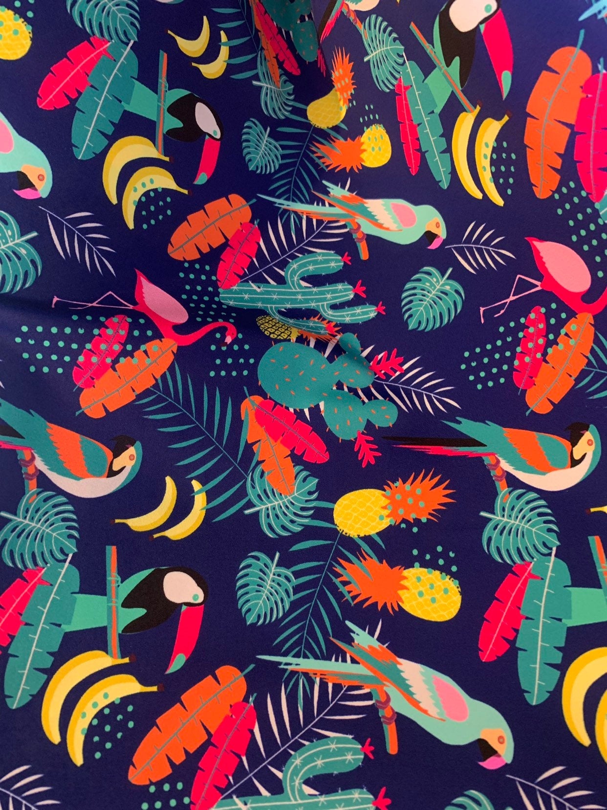 New tropical print nylon spandex multicolor 4way stretch 58/60" Sold by the YD. Ships worldwide from Los Angeles California USA.