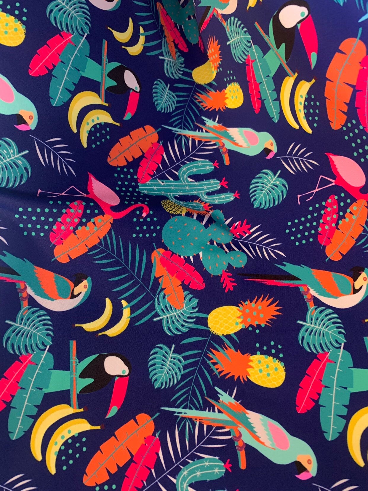 New tropical print nylon spandex multicolor 4way stretch 58/60" Sold by the YD. Ships worldwide from Los Angeles California USA.