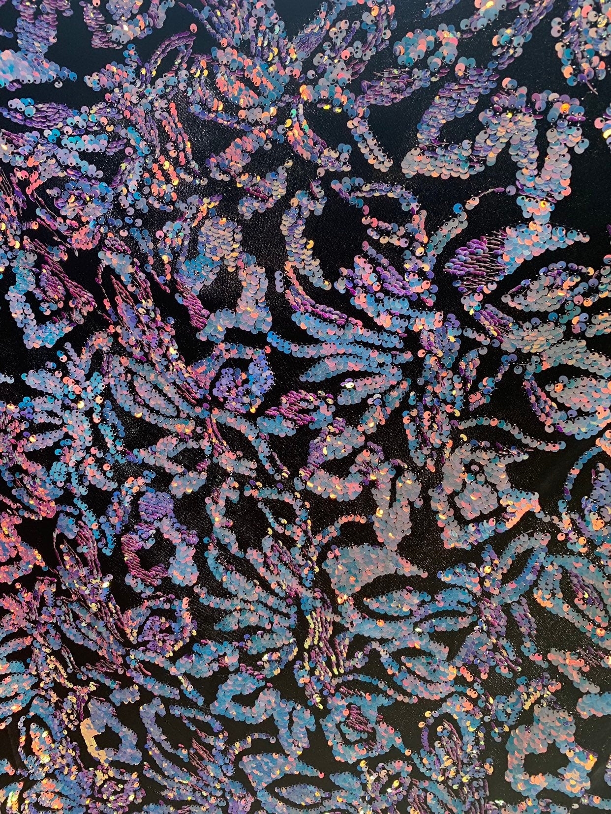 New iridescent sequins Isabella flower design on heavy black stretch velvet 4way stretch 58/60" Sold by the YD. Ships worldwide from L.A CA