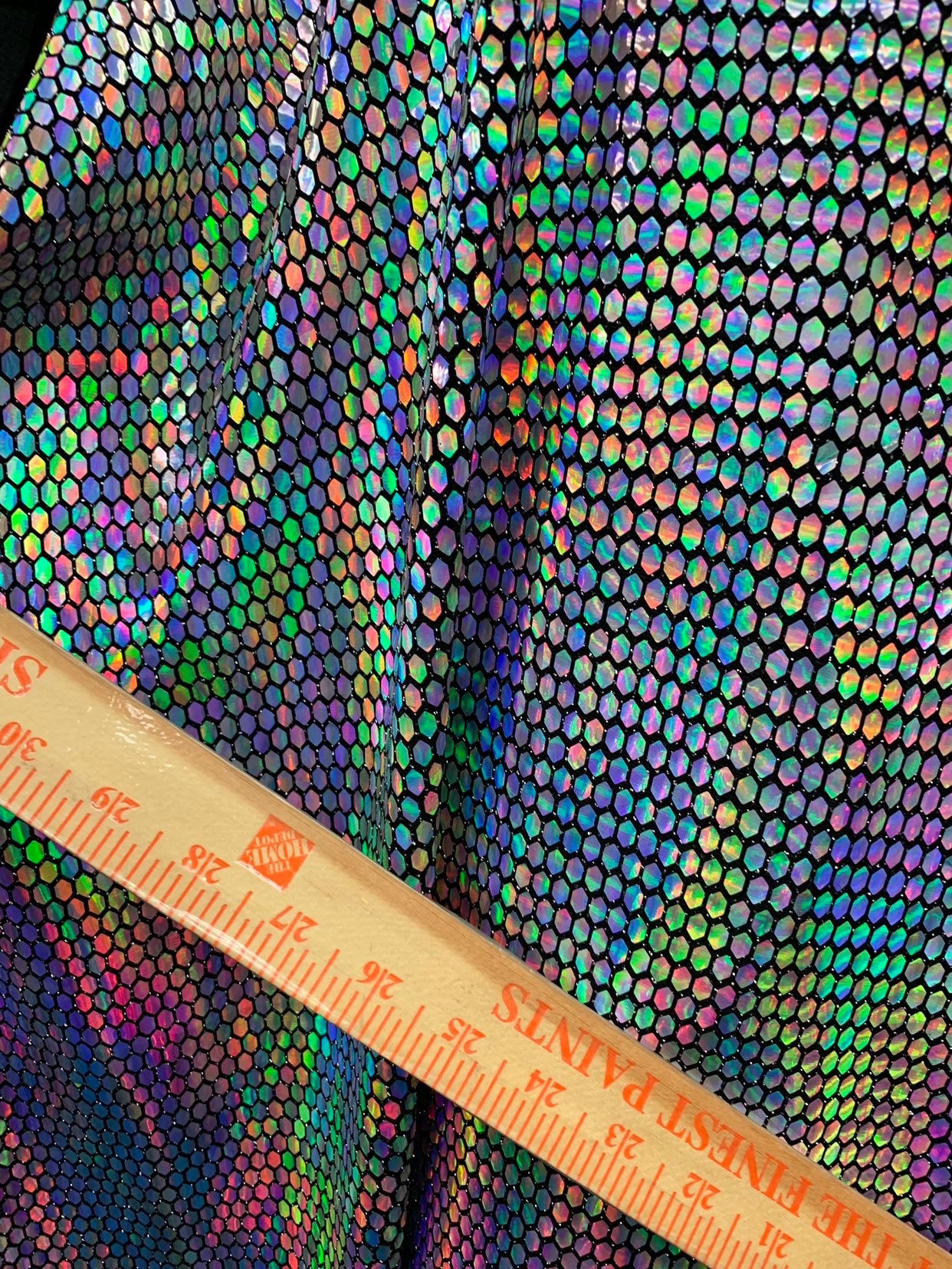 New hexagon hologram sequins on metallic spandex base 4way stretch 58/60" Sold by the YD. Ships worldwide from Los Angeles California USA.