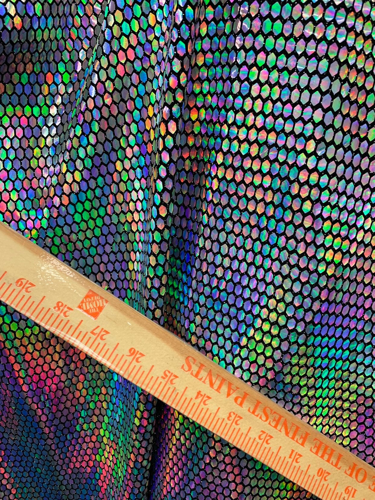 New hexagon hologram sequins on metallic spandex base 4way stretch 58/60" Sold by the YD. Ships worldwide from Los Angeles California USA.
