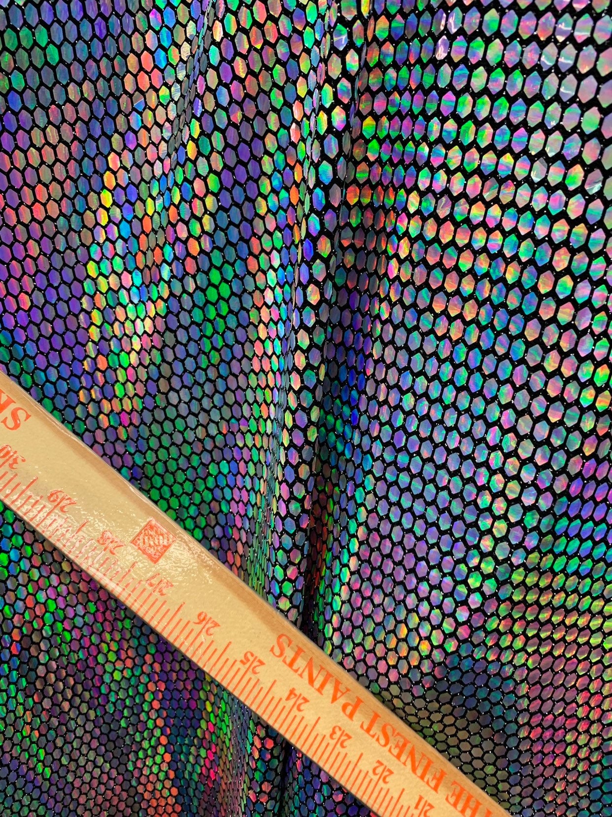 New hexagon hologram sequins on metallic spandex base 4way stretch 58/60" Sold by the YD. Ships worldwide from Los Angeles California USA.