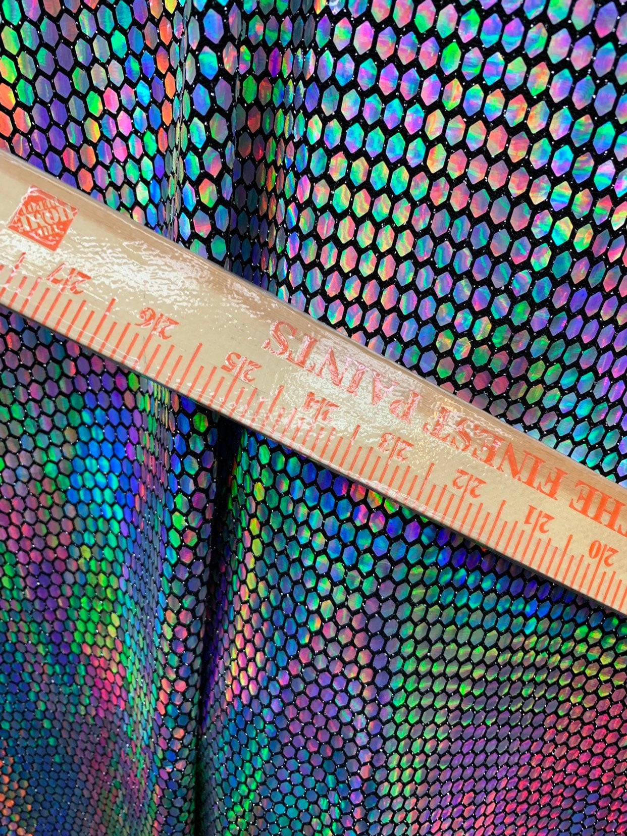 New hexagon hologram sequins on metallic spandex base 4way stretch 58/60" Sold by the YD. Ships worldwide from Los Angeles California USA.