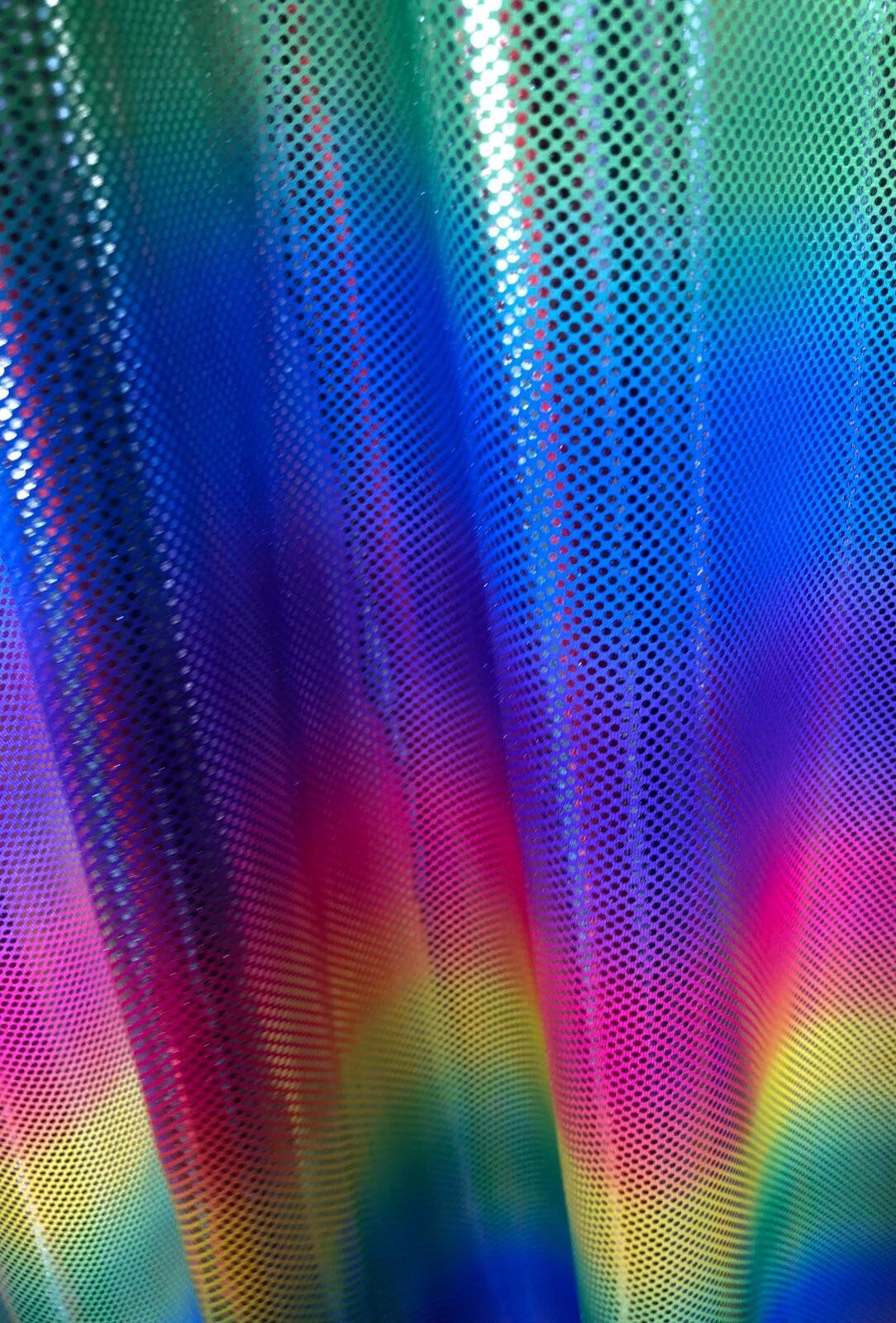 New metallic rainbow design with silver dots nylon spandex 4way stretch 58/60" Sold by the YD. Ships worldwide from Los Angeles California.