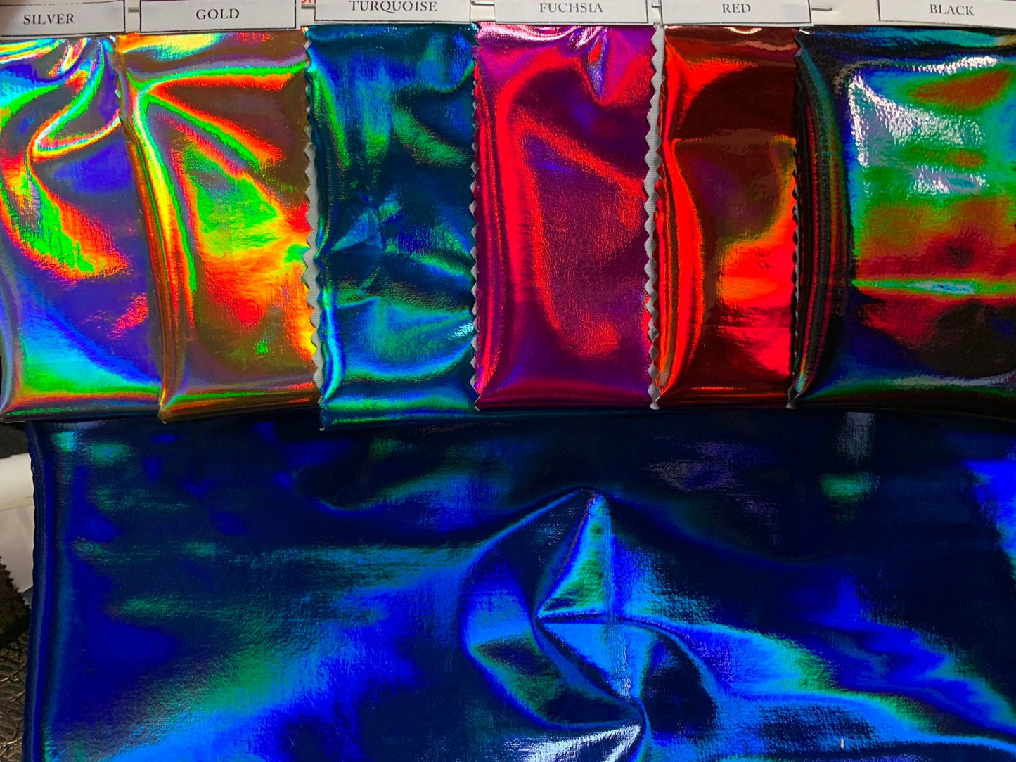 New poly spandex polyurethane coated & holo printed Iridescent super shining vinyl 4-way stretch 58/60" Sold by the YD. Ships worldwide.