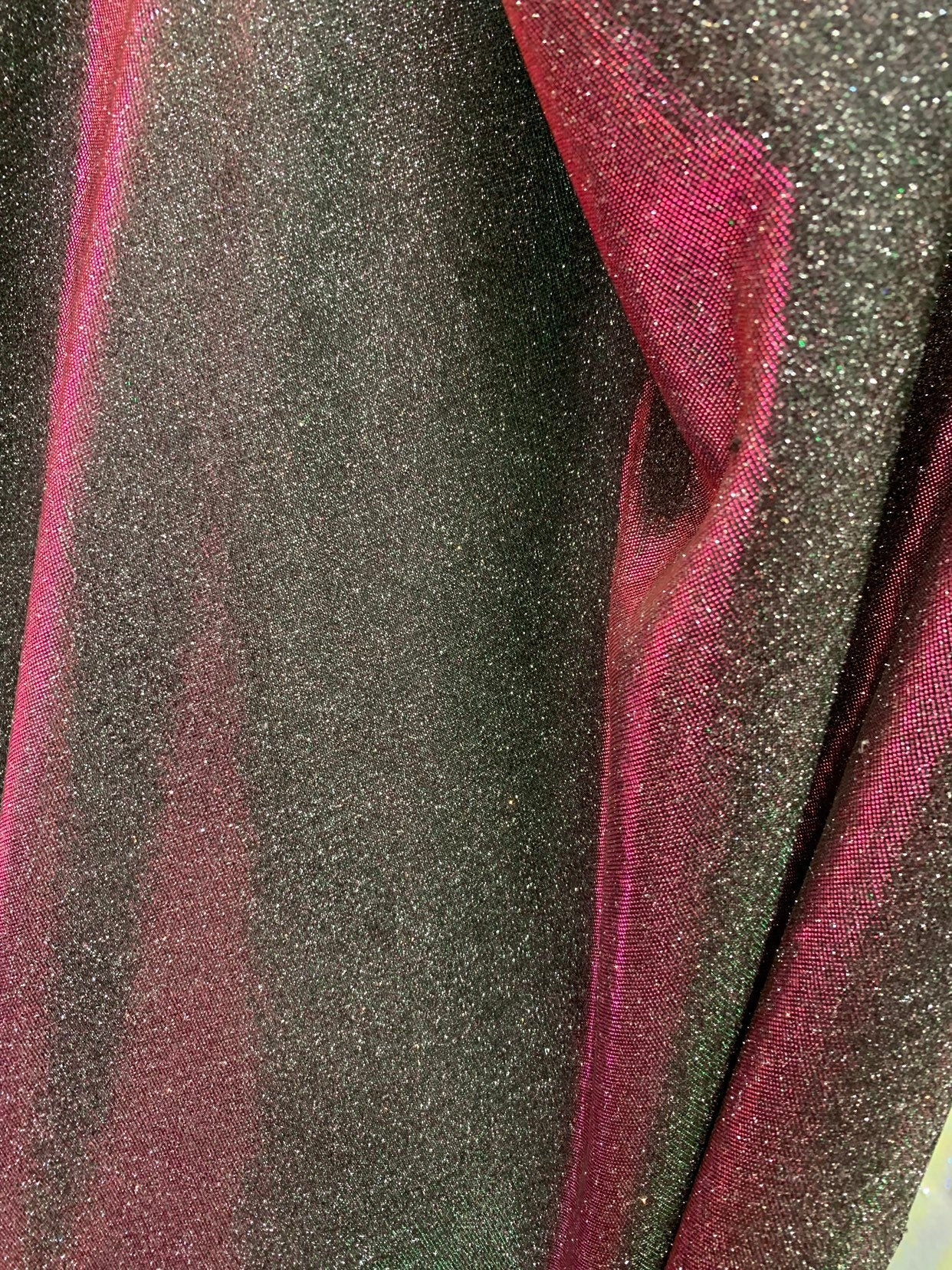 New Iridescent heavy metallic poly super techno fabric 4 way stretch 58/60" Sold by the YD. Ships worldwide from Los Angeles California USA.