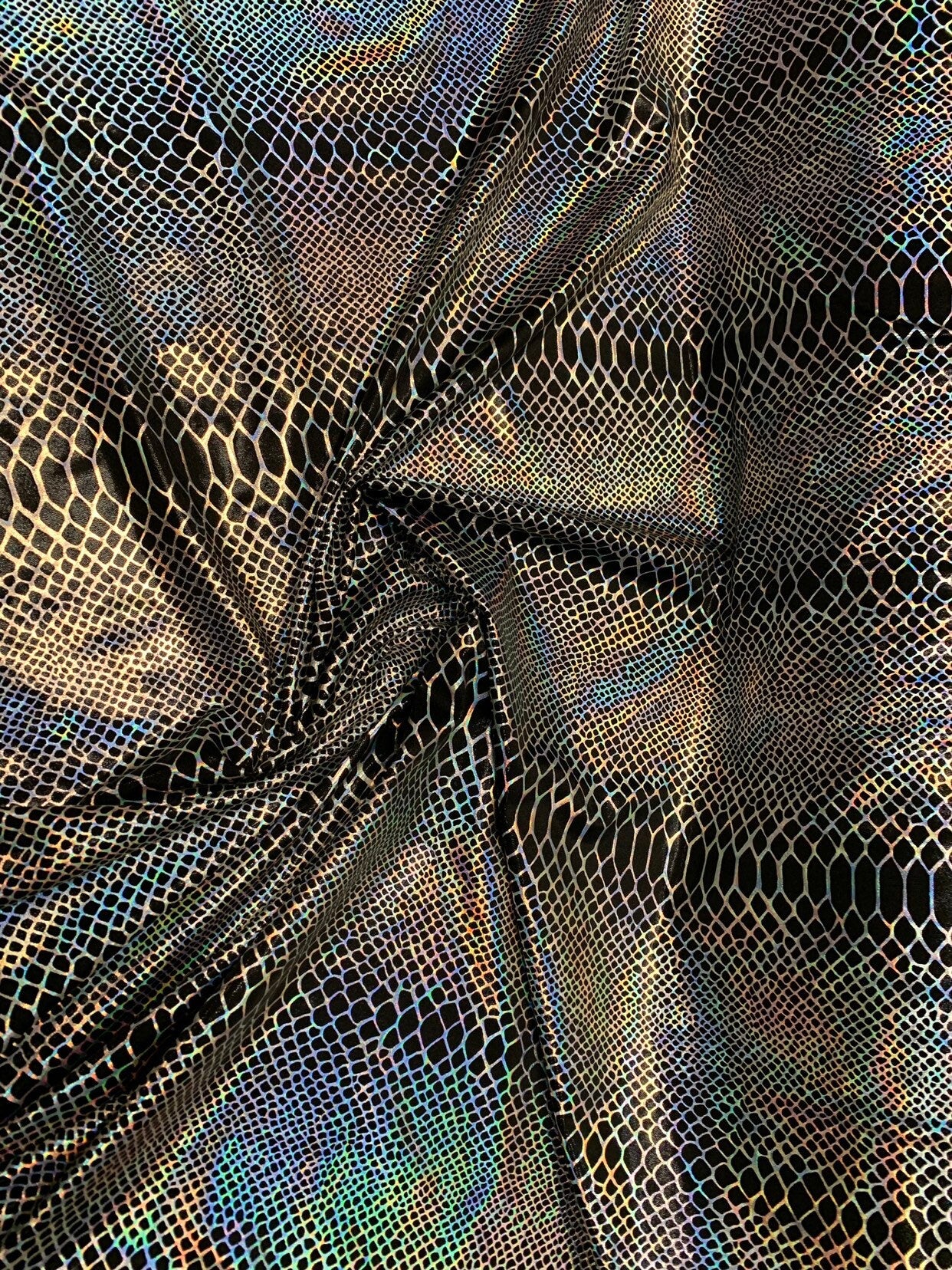 Dragón design Iridescent two tone hologram metallic nylon spandex 4way stretch 58/60" Sold by the YD. Ships worldwide from Los Angeles CA.