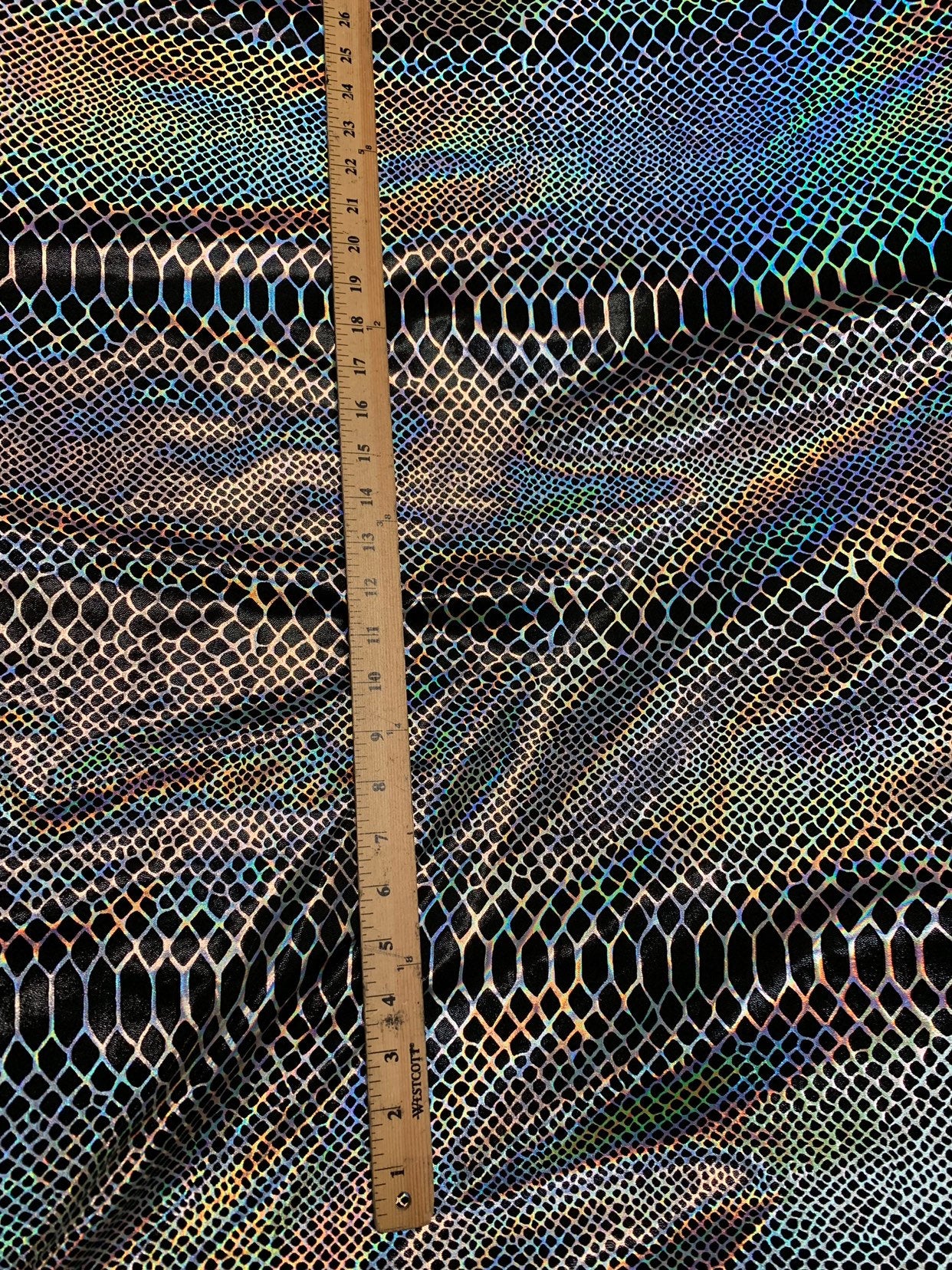 Dragón design Iridescent two tone hologram metallic nylon spandex 4way stretch 58/60" Sold by the YD. Ships worldwide from Los Angeles CA.