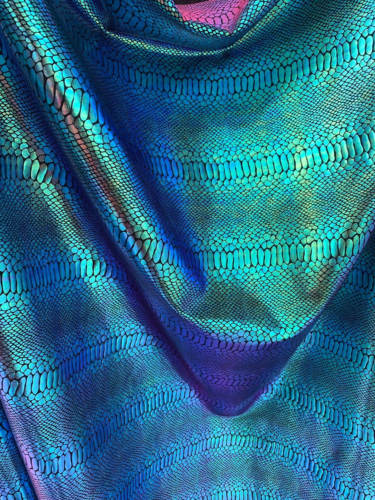 New Iridescent snake foil 2 tone blue/green metallic nylon spandex 4way stretch 58/60" Sold by the YD. Ships worldwide from Los Angeles CA.