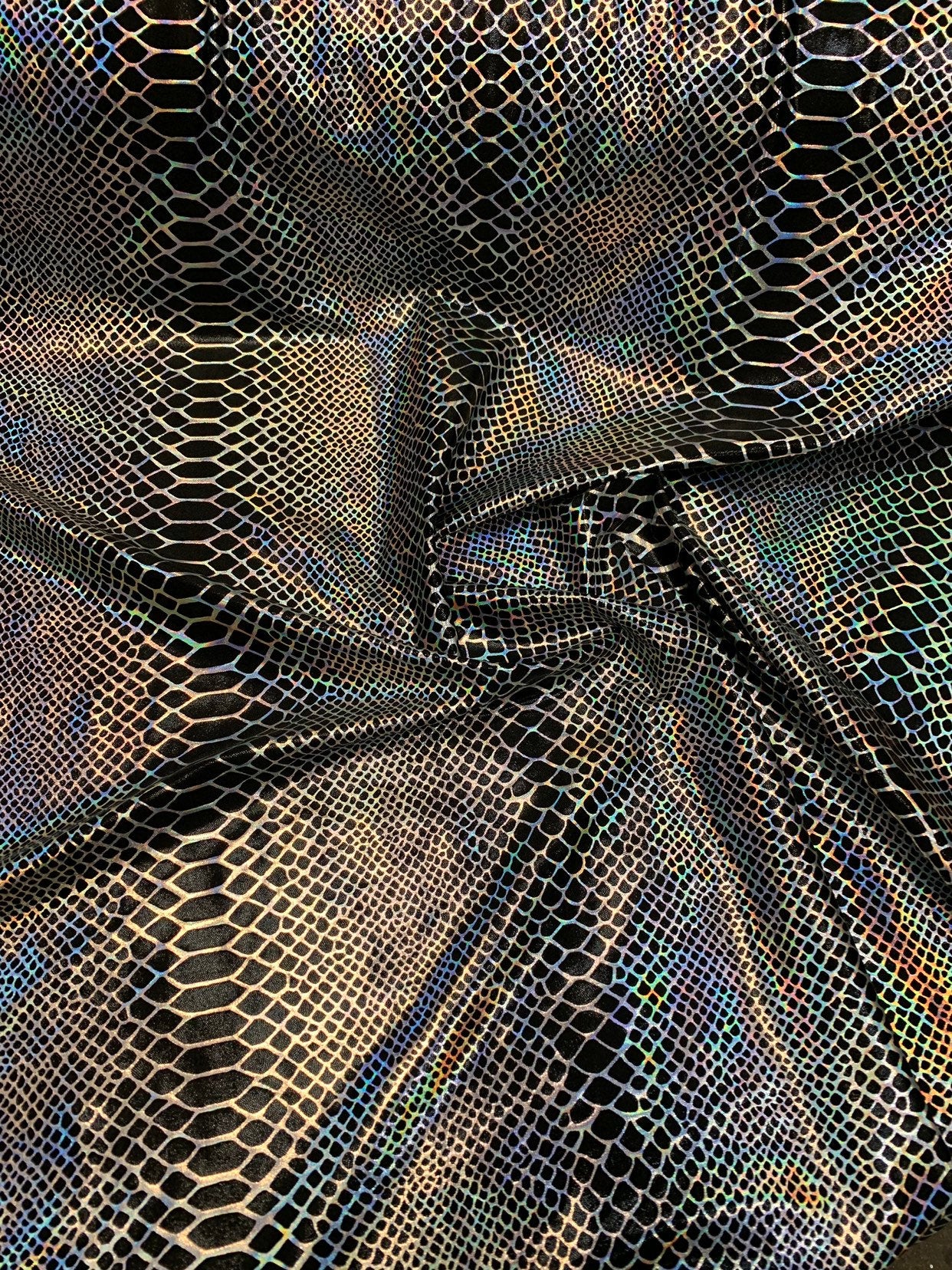 Dragón design Iridescent two tone hologram metallic nylon spandex 4way stretch 58/60" Sold by the YD. Ships worldwide from Los Angeles CA.