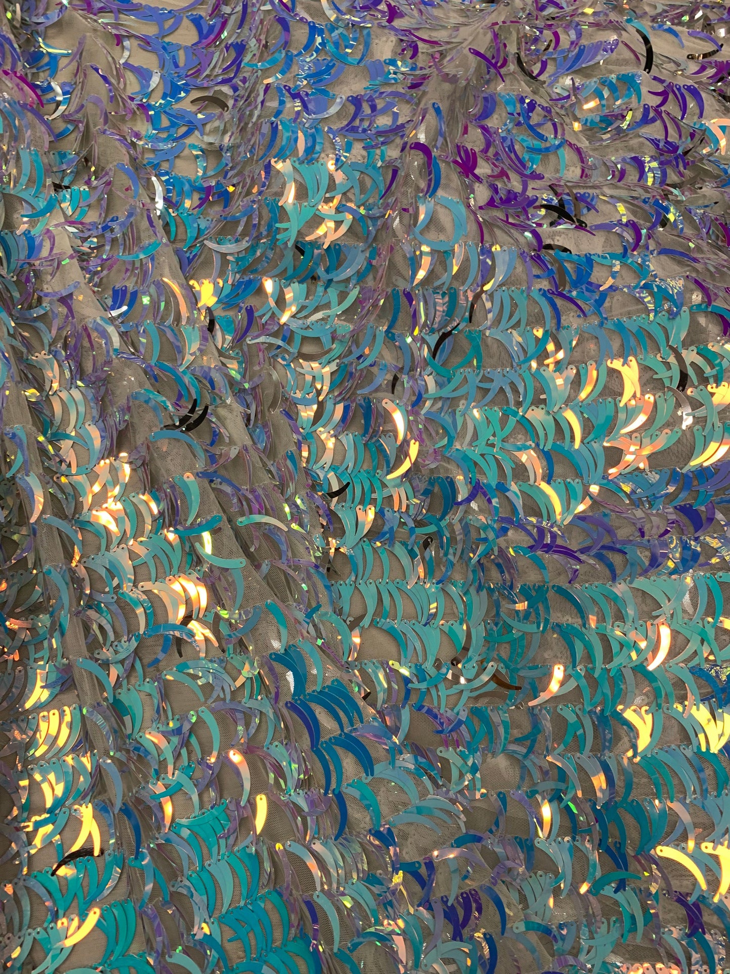 New Iridescent sequins half moon design on stretch mesh 2-way 58/60” Sold by the YD. Ships worldwide from Los Angeles California USA.