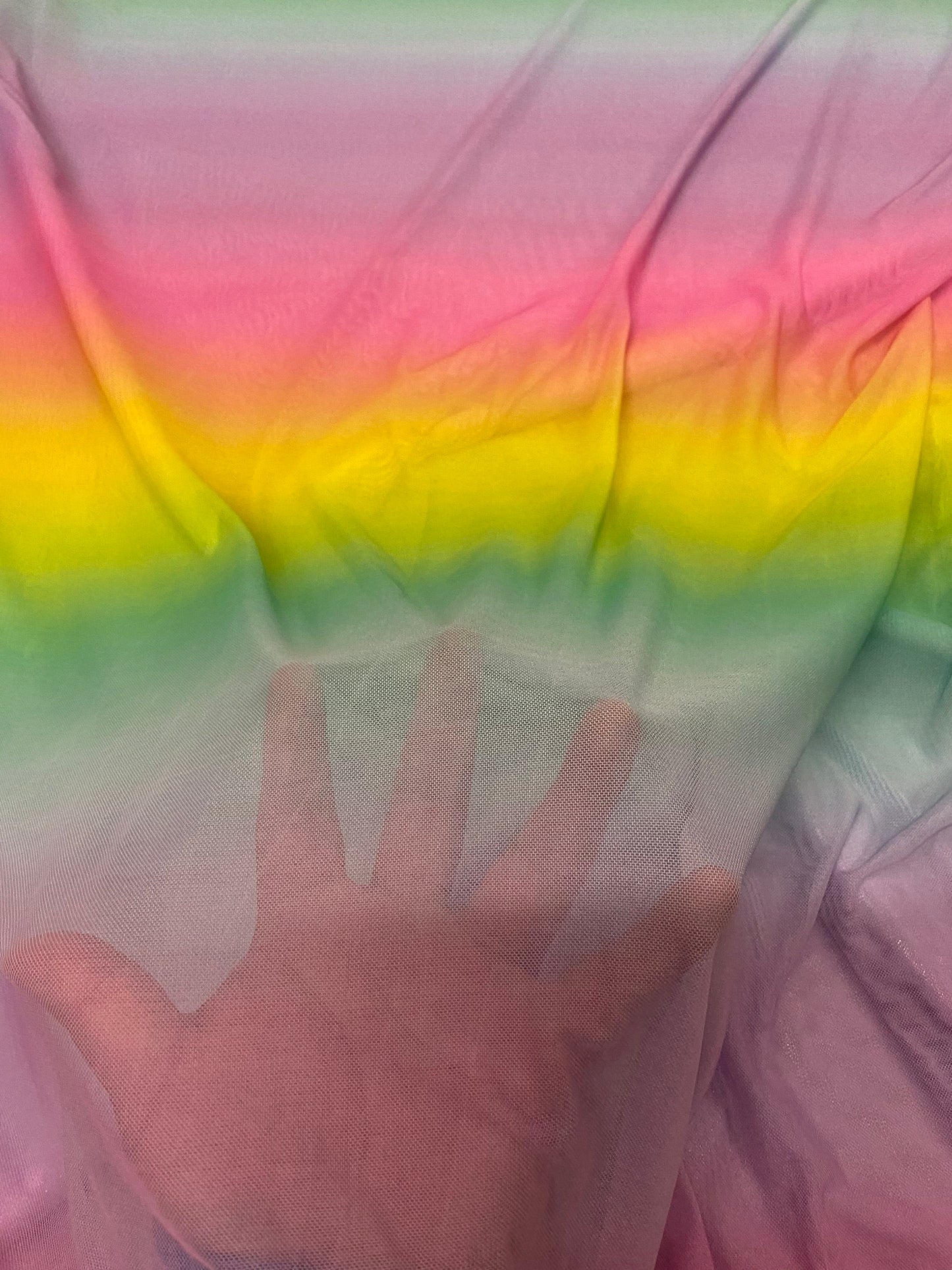 New rainbow design power mesh 4-way stretch nylon quality 58/60” Sold by the YD. Ships worldwide from Los Angeles California USA.