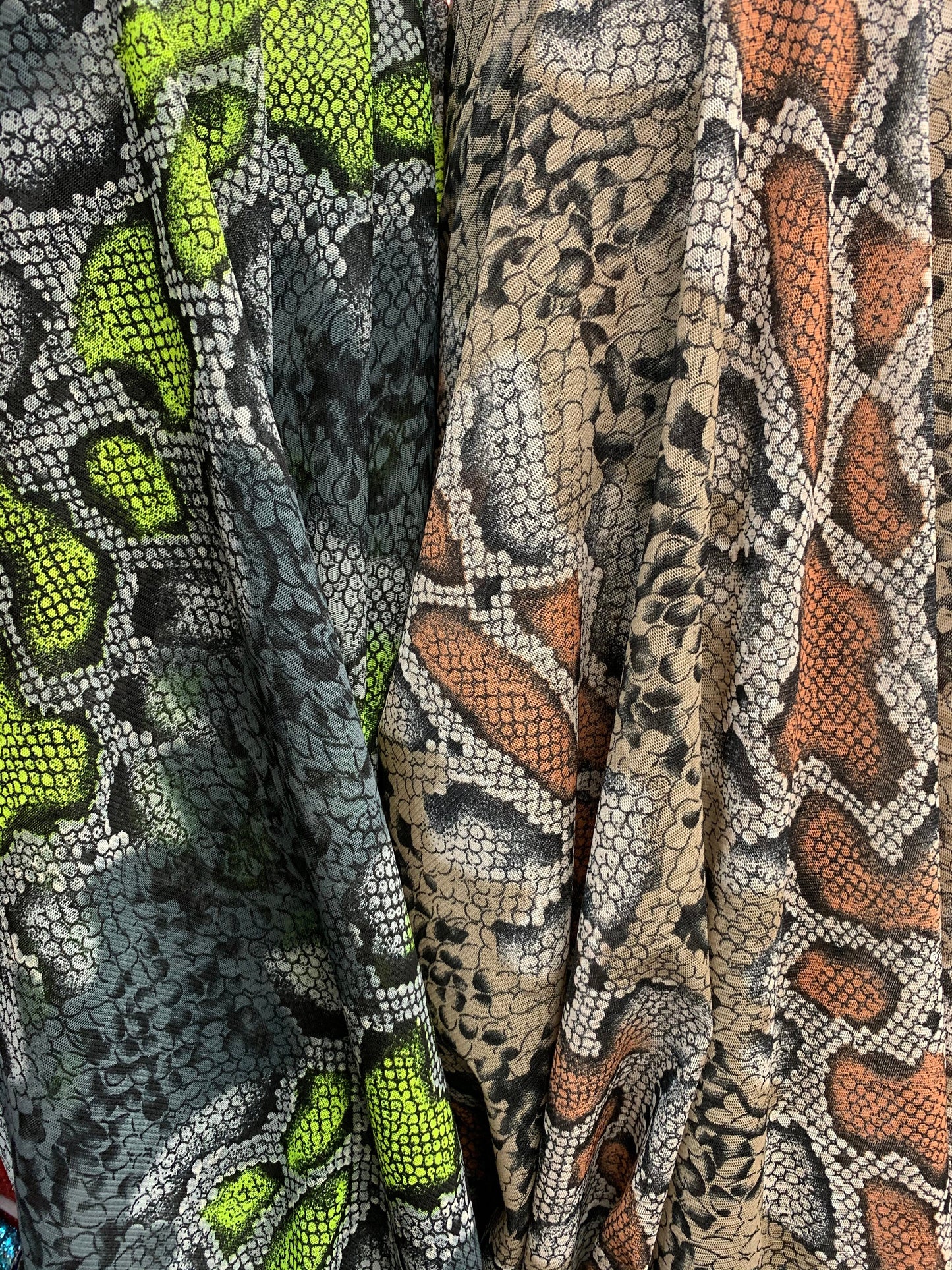 New stretch mesh exotic snake design it glows in the dark 4-way Stretch 58/60” Sold by the YD. Ships worldwide from Los Ángeles California