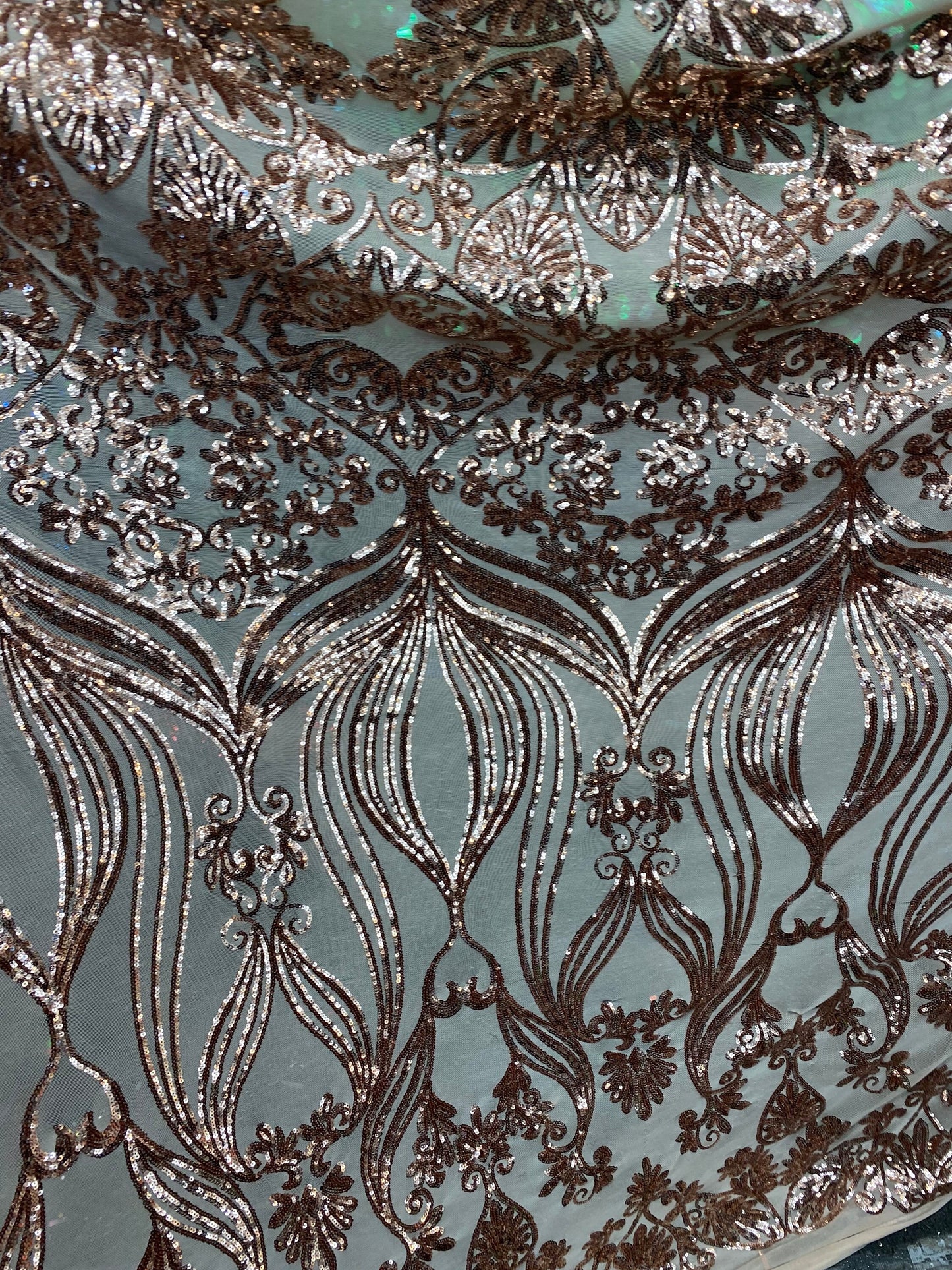 New modern sequins Jennifer design iridescent sequins on stretch mesh 2-way 58/60” Sold by the YD. Ships worldwide from Los Angeles CA USA.