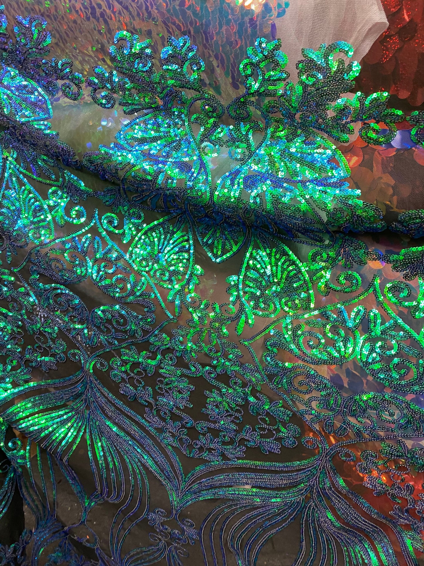 New modern sequins Jennifer design iridescent sequins on stretch mesh 2-way 58/60” Sold by the YD. Ships worldwide from Los Angeles CA USA.