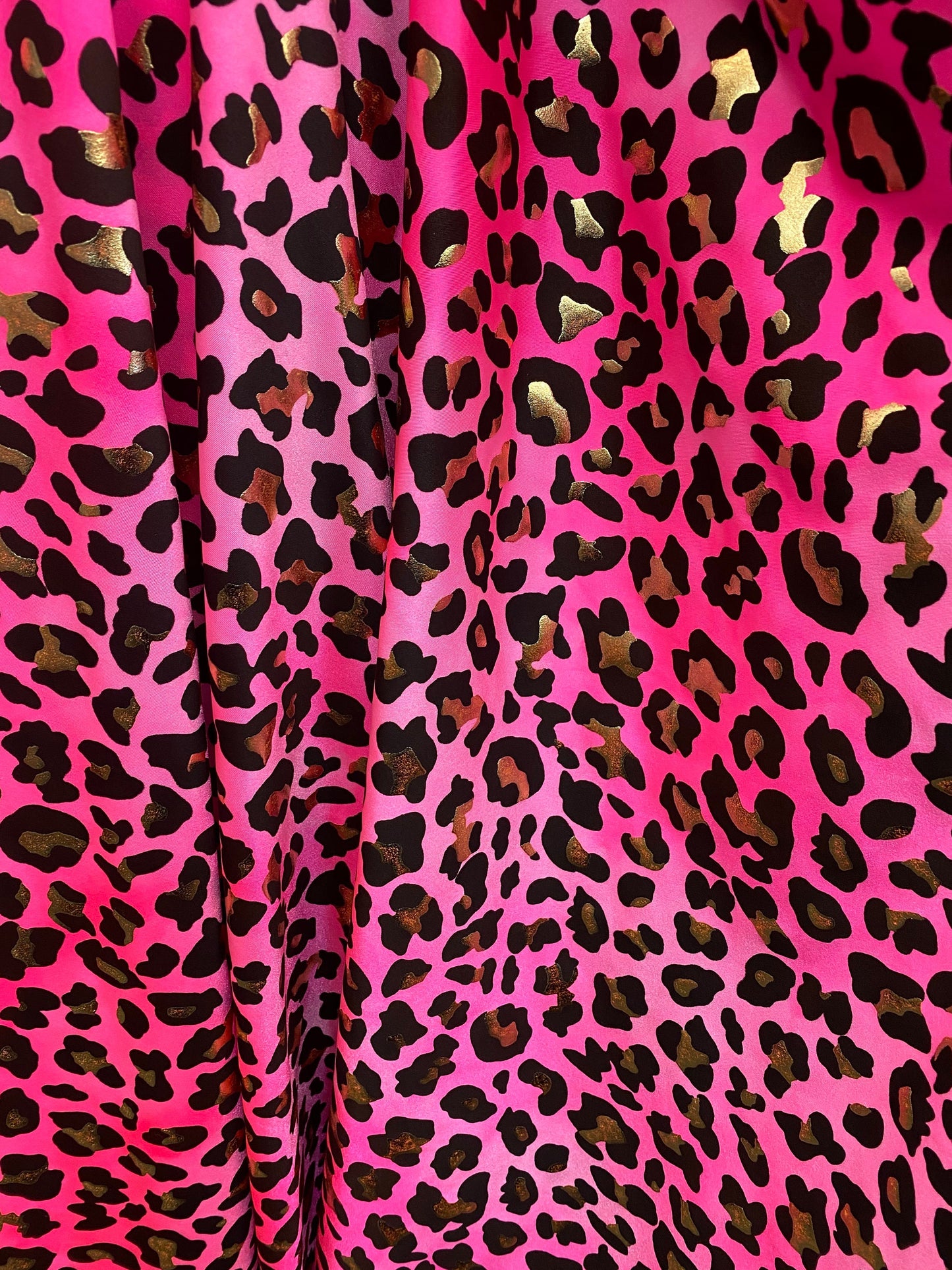 New exotic metallic leopard design nylon spandex 4-way stretch it glows in the dark 58/60” Sold by the YD. Ships worldwide from Los Angeles