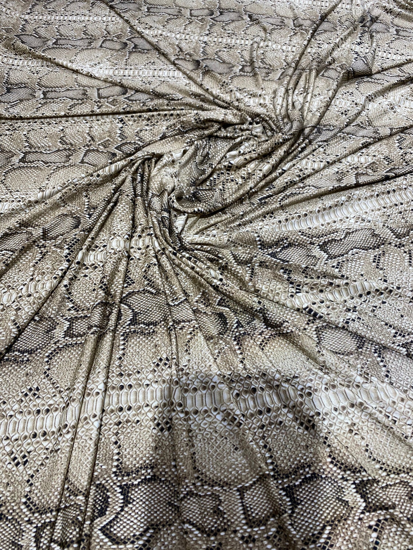 New exotic snake design taupe/black medium weight 4-way stretch 58/60” Sold by the YD. Ships worldwide from Los Angeles California USA.
