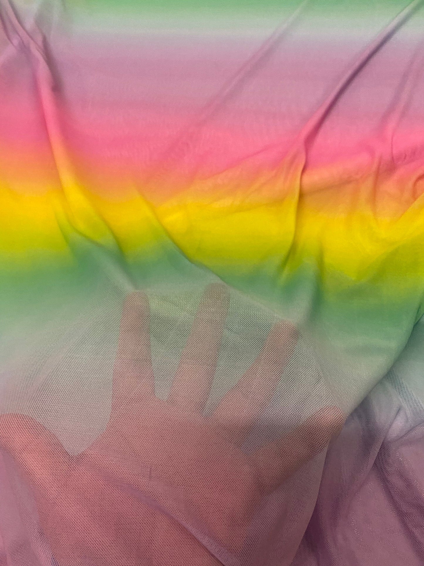 New rainbow design power mesh 4-way stretch nylon quality 58/60” Sold by the YD. Ships worldwide from Los Angeles California USA.