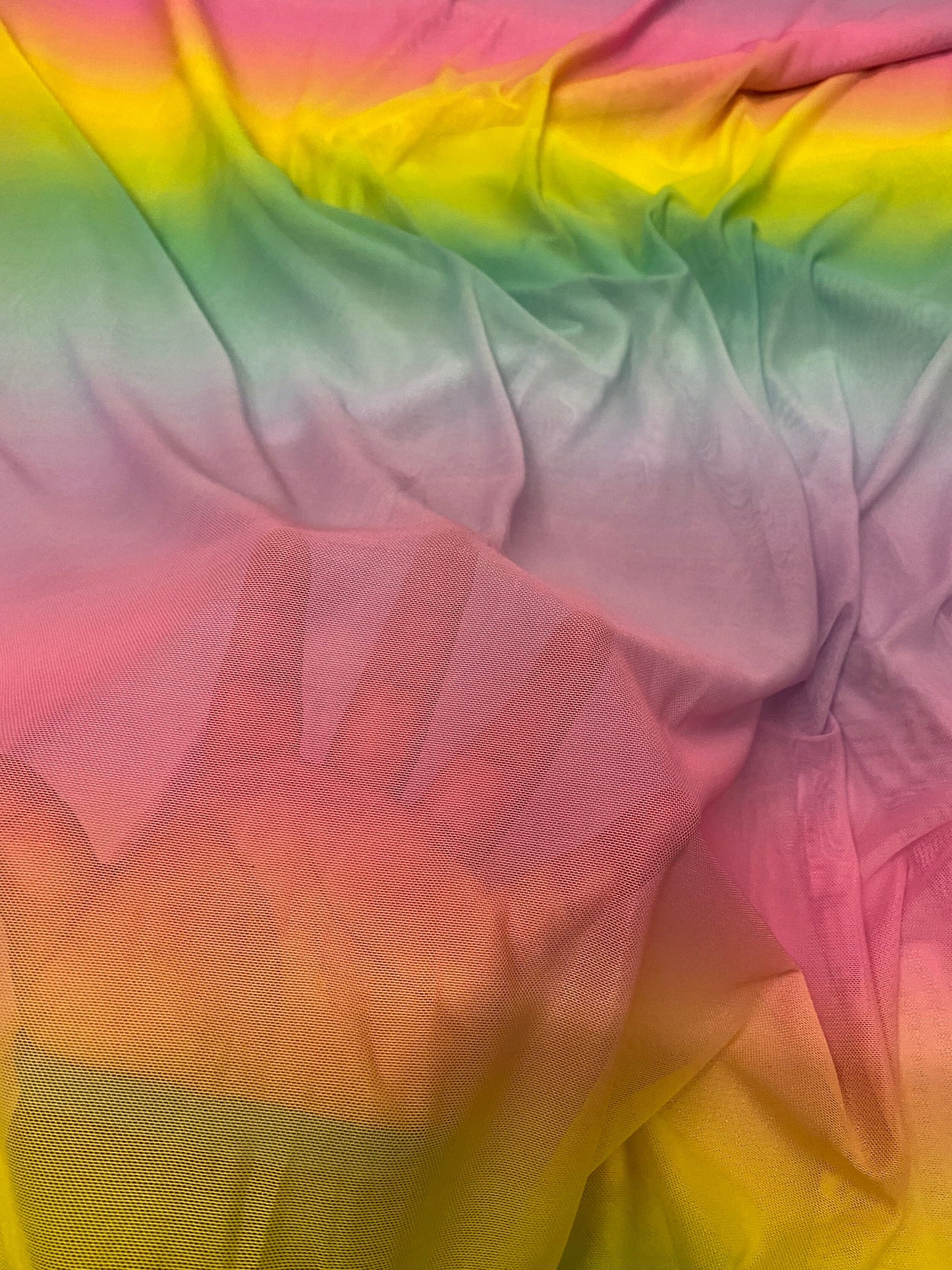 New rainbow design power mesh 4-way stretch nylon quality 58/60” Sold by the YD. Ships worldwide from Los Angeles California USA.