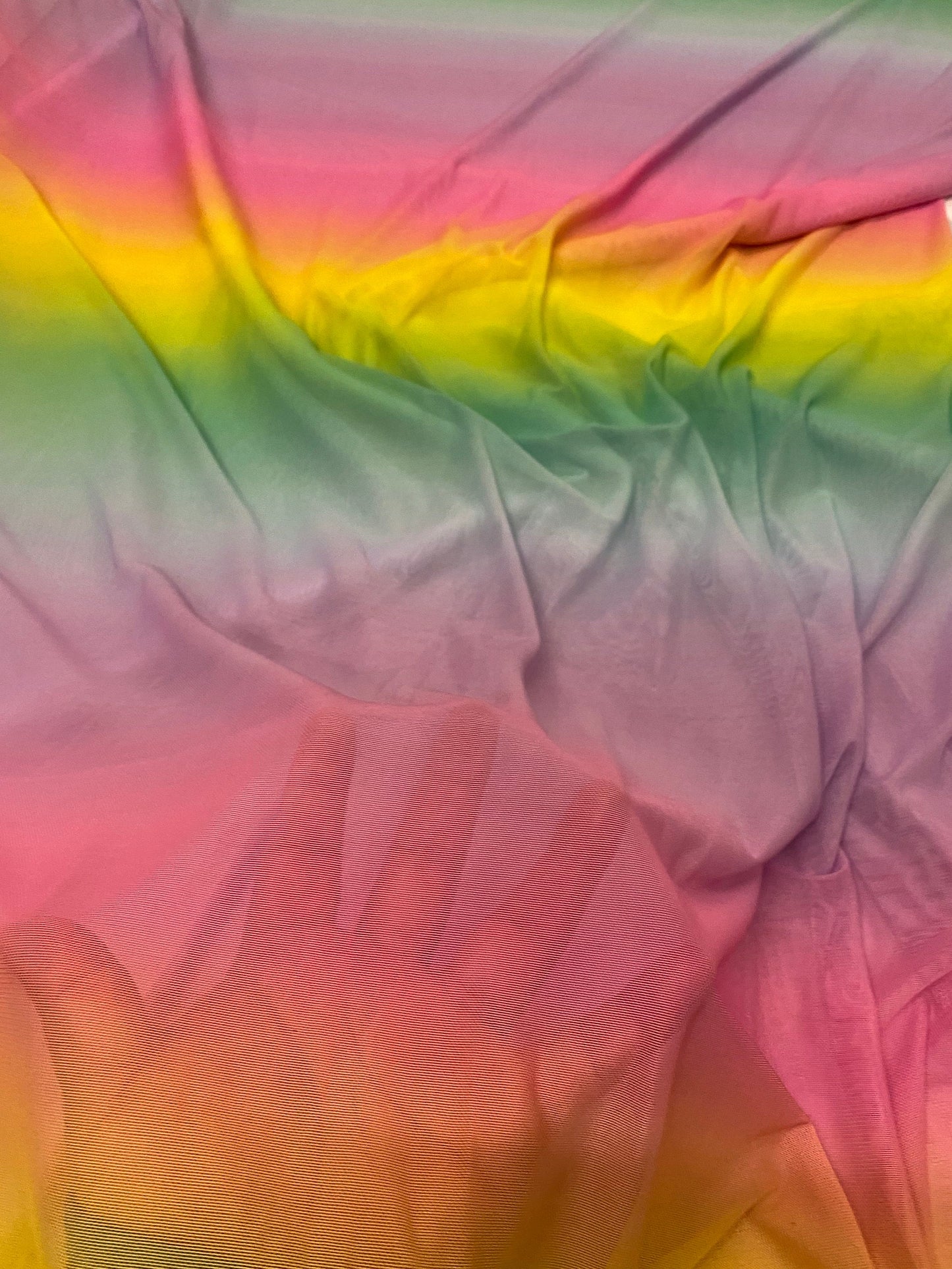 New rainbow design power mesh 4-way stretch nylon quality 58/60” Sold by the YD. Ships worldwide from Los Angeles California USA.